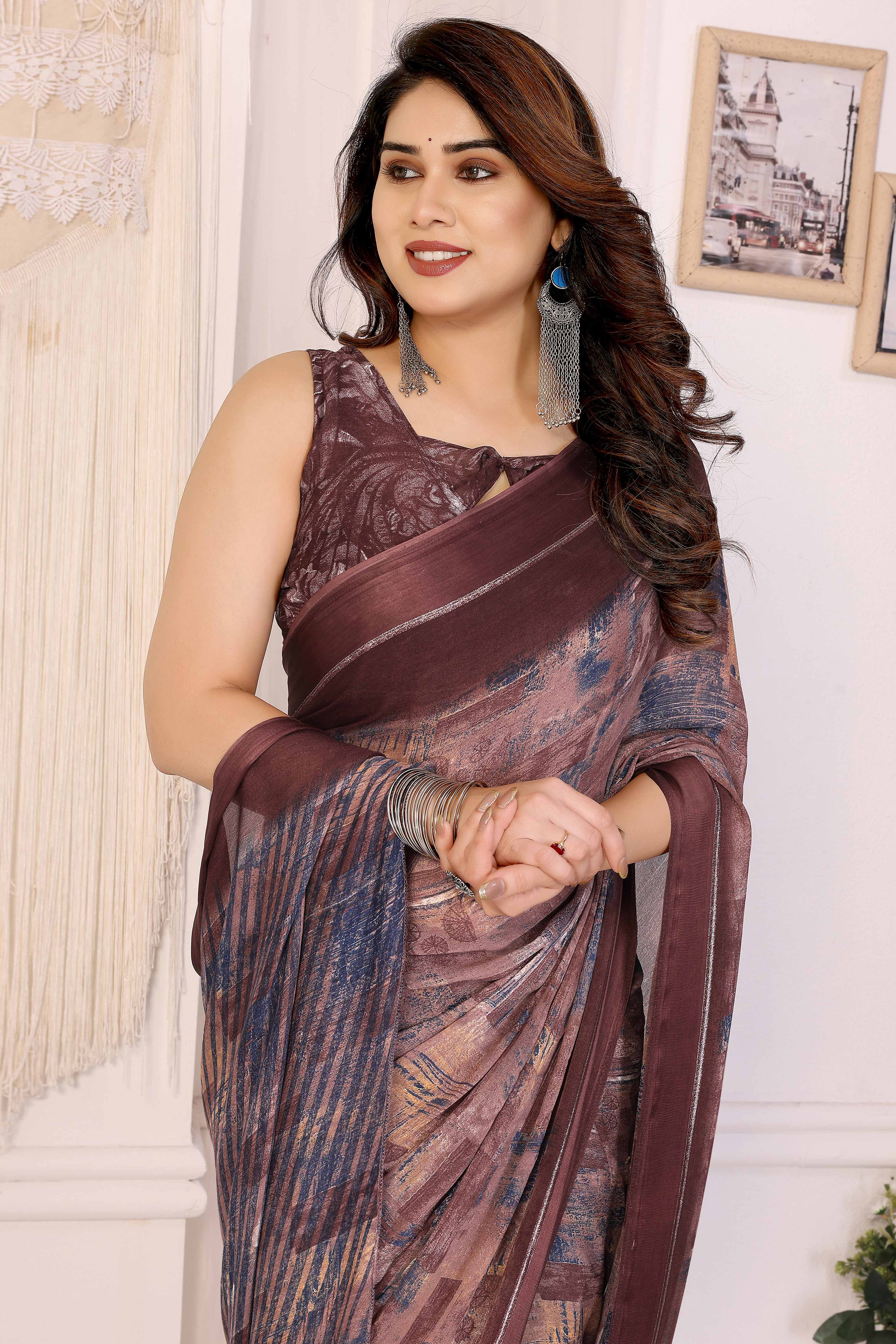Trendy Brown Moss Crepe Saree with Floral Motifs and Satin Border