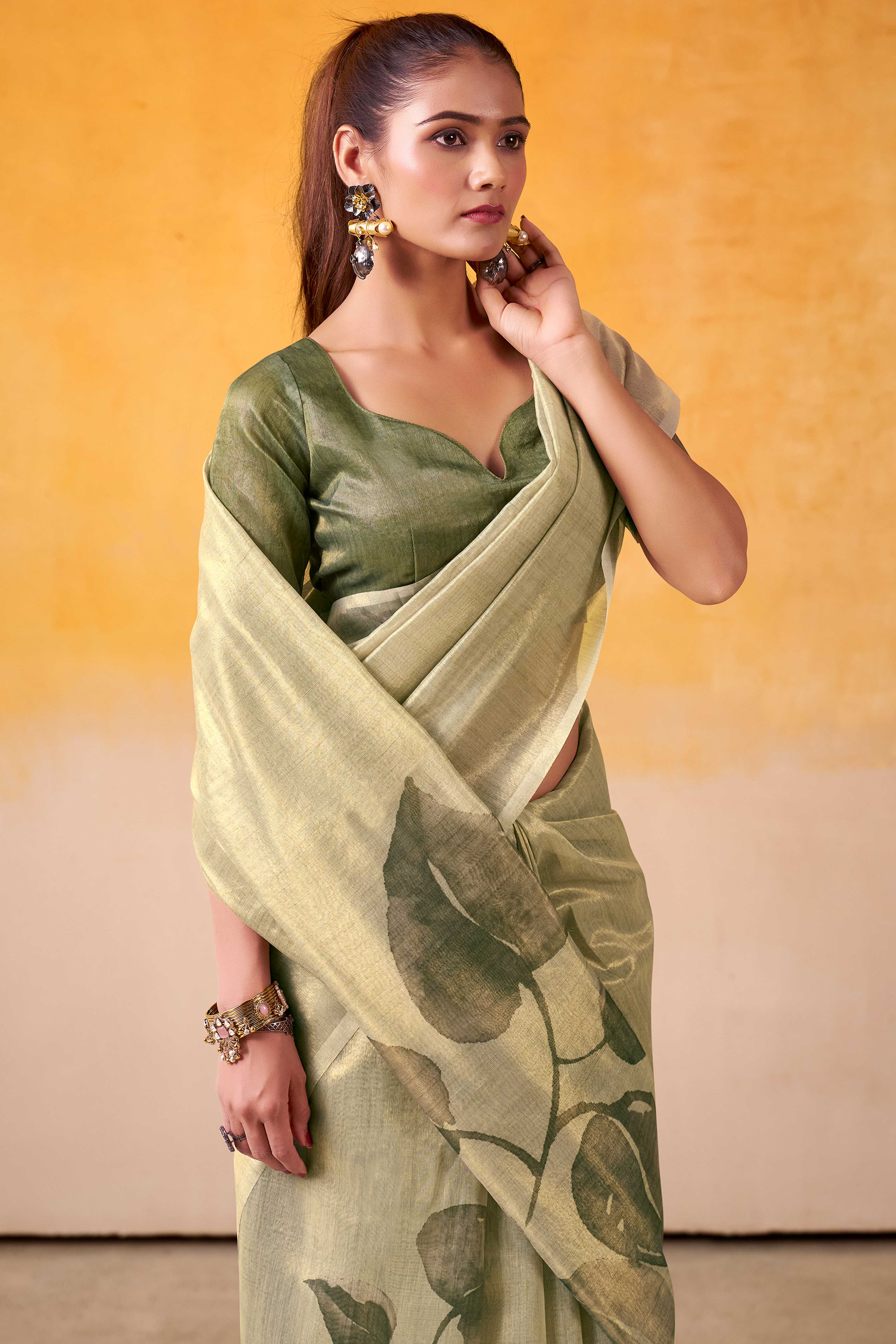 Sophisticated Light Pista Green Floral Digital Print Tissue Saree Enhanced With Handmade Tassels