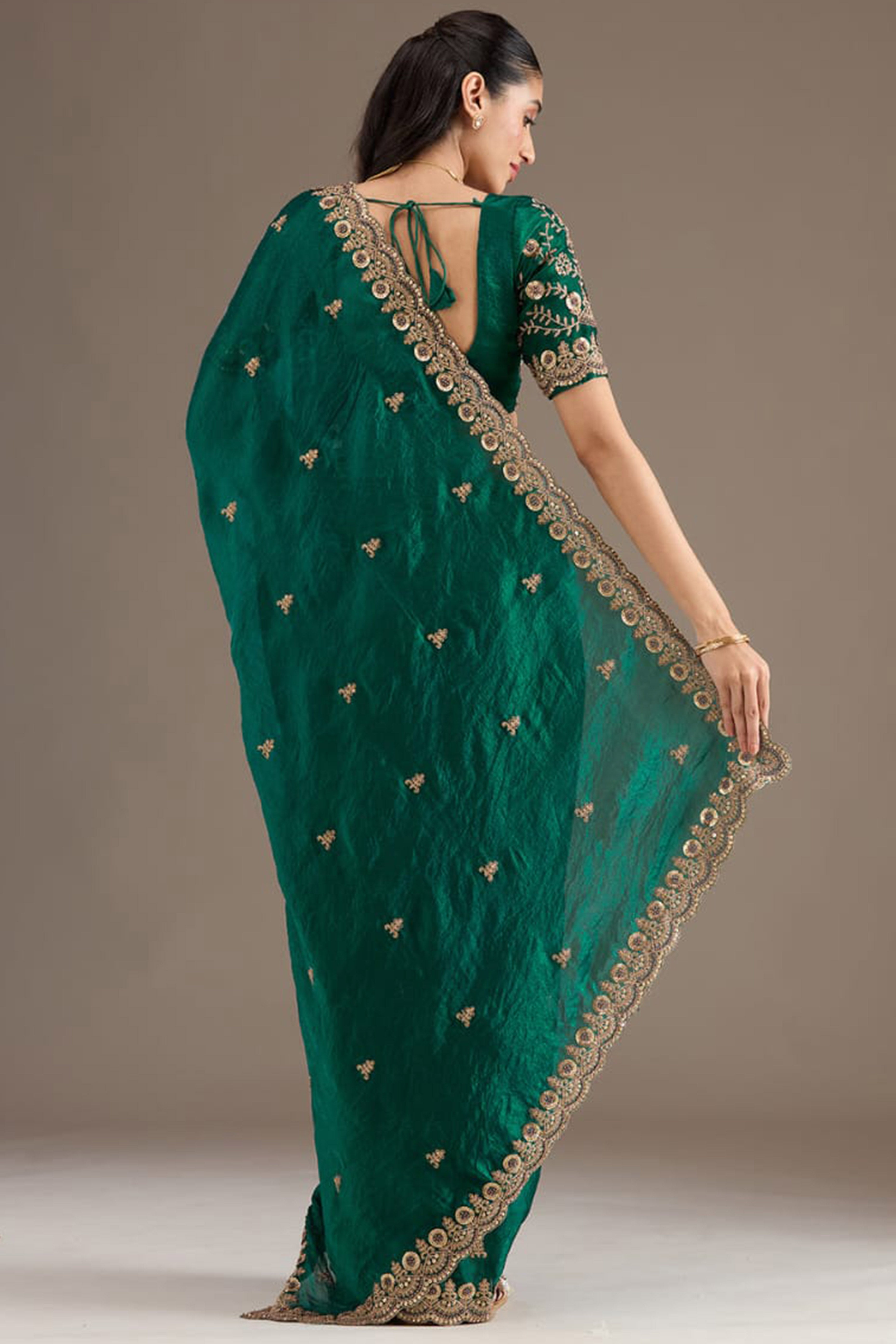 Trendy Green Fancy Satin Saree Enhanced With Rich Golden Embroidered Design