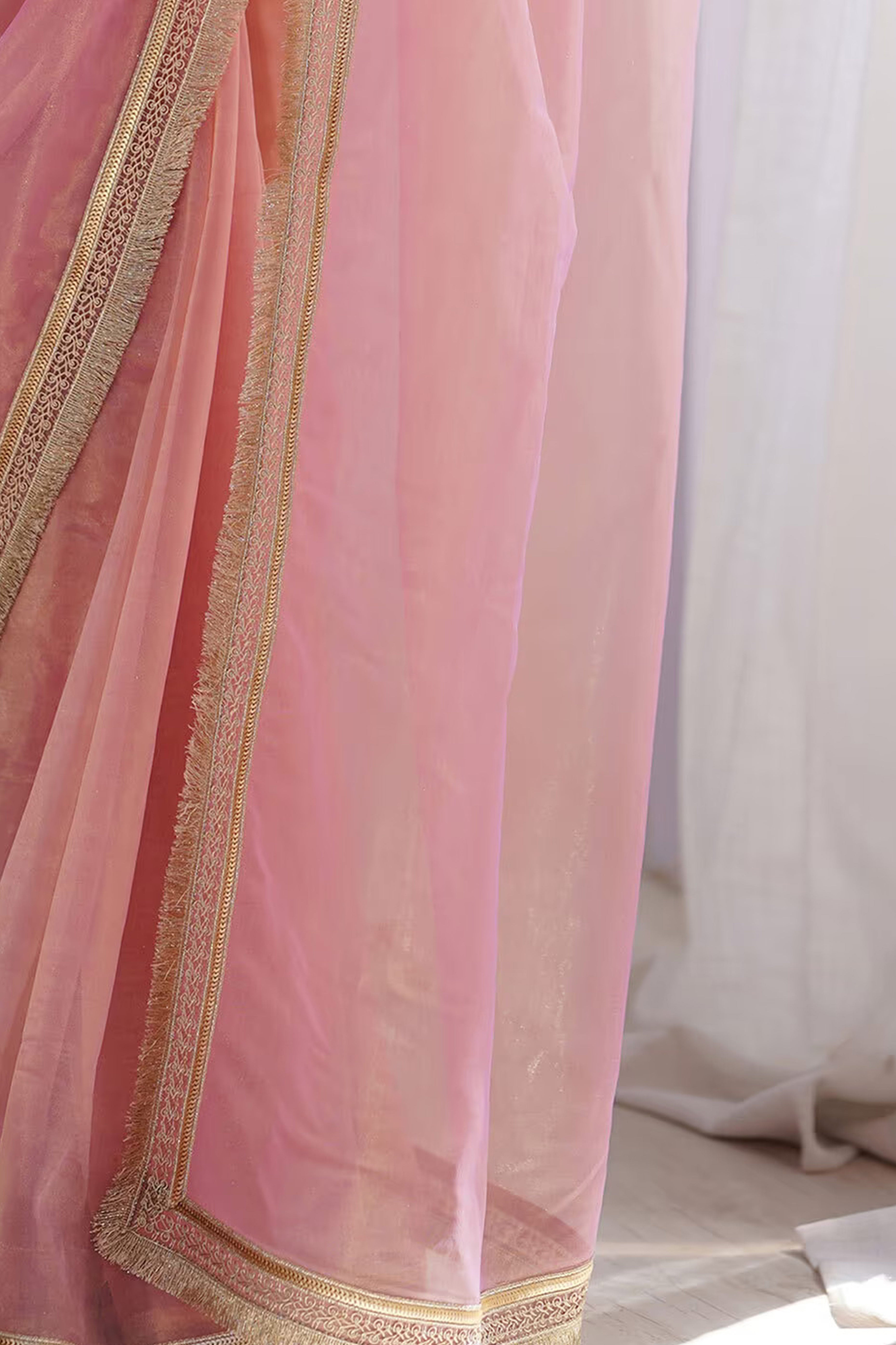 Feminine Rose Pink Solid Net Saree with Sophisticated Lace Border Work