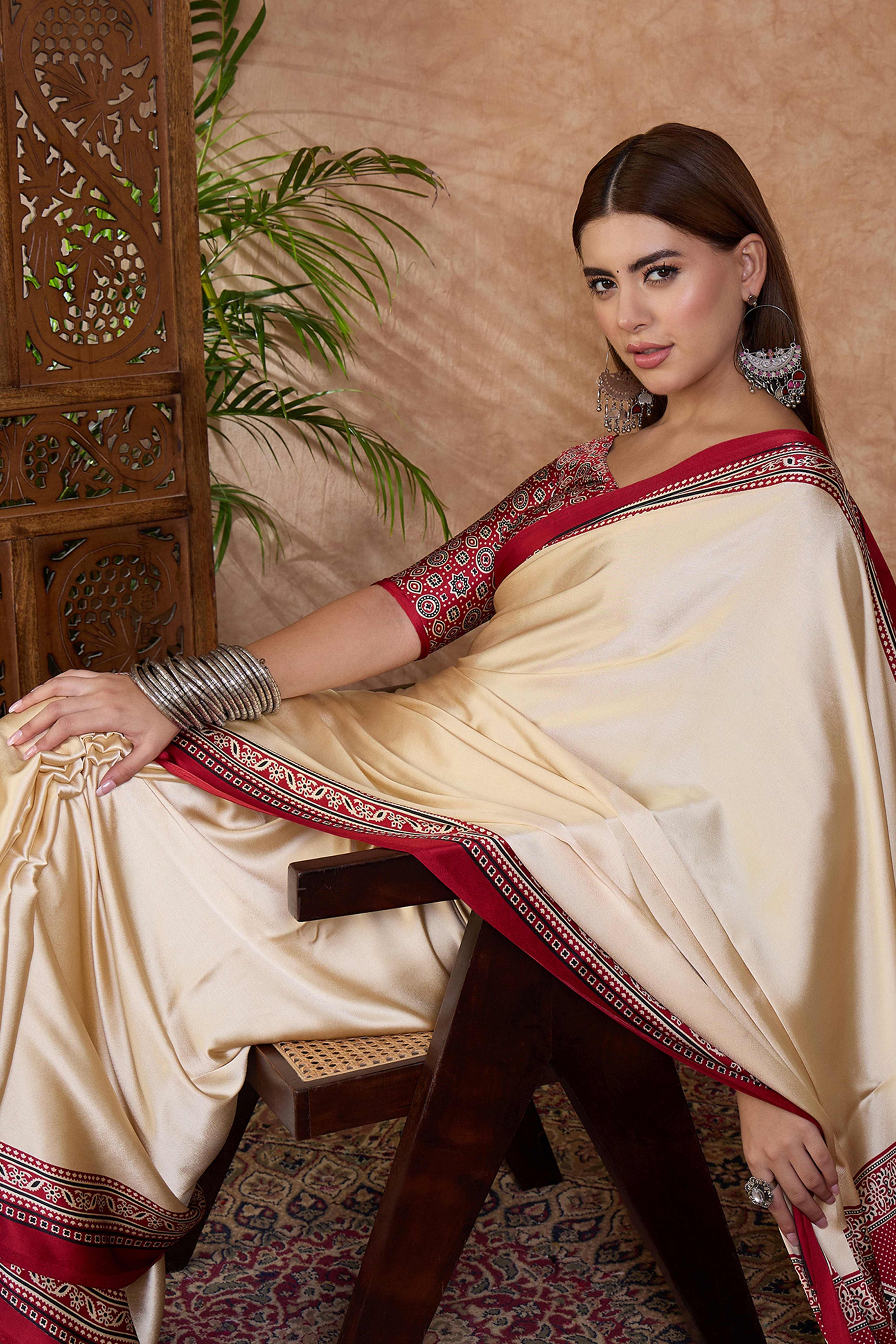 Cream & Red Modal Satin Saree Featuring a Solid Base and Artisanal Ajrakh Pallu