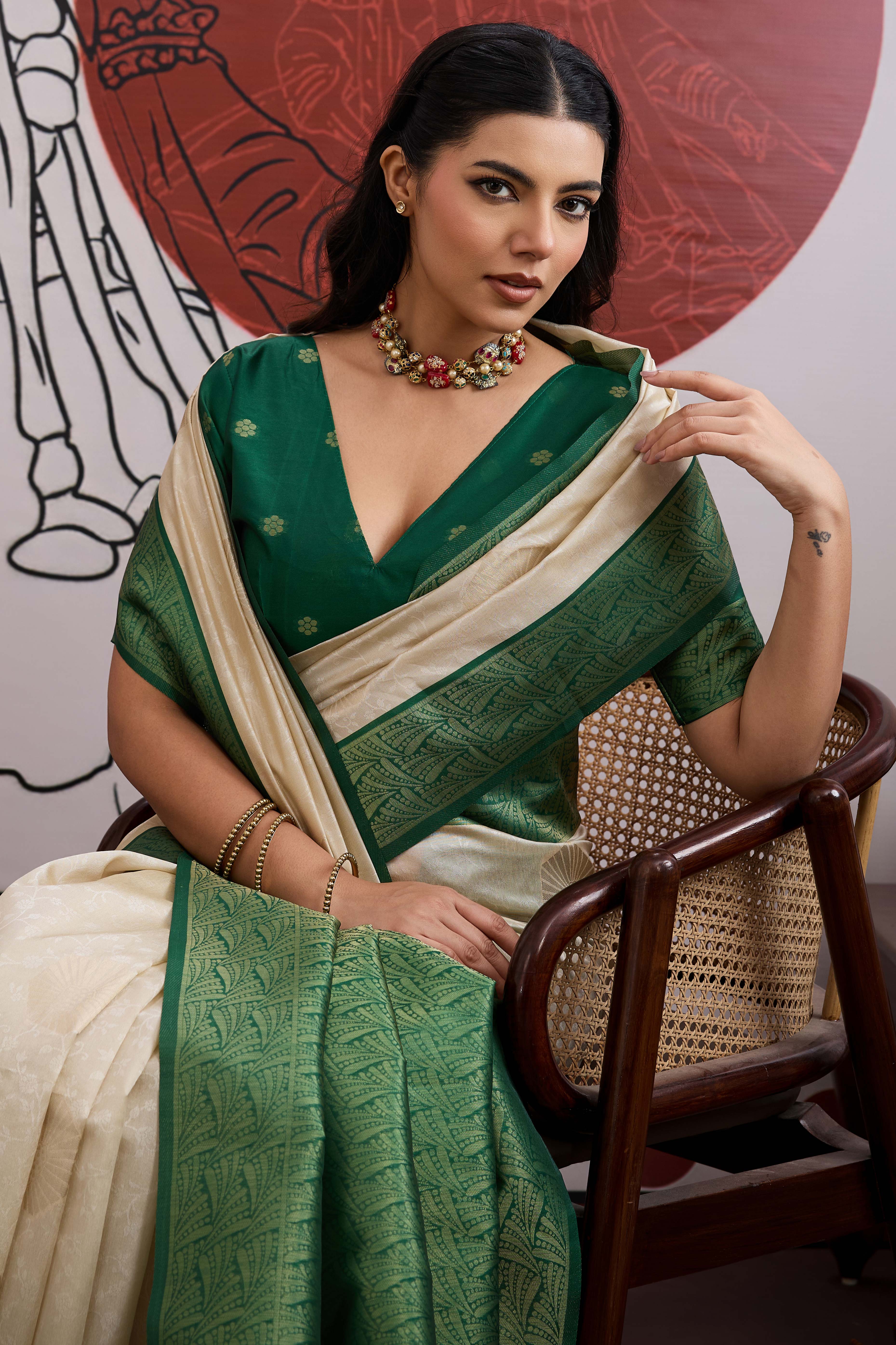 Graceful Cream & Green Zari Weaving Silk Saree Highlighted By Decorative Tassel Pallu