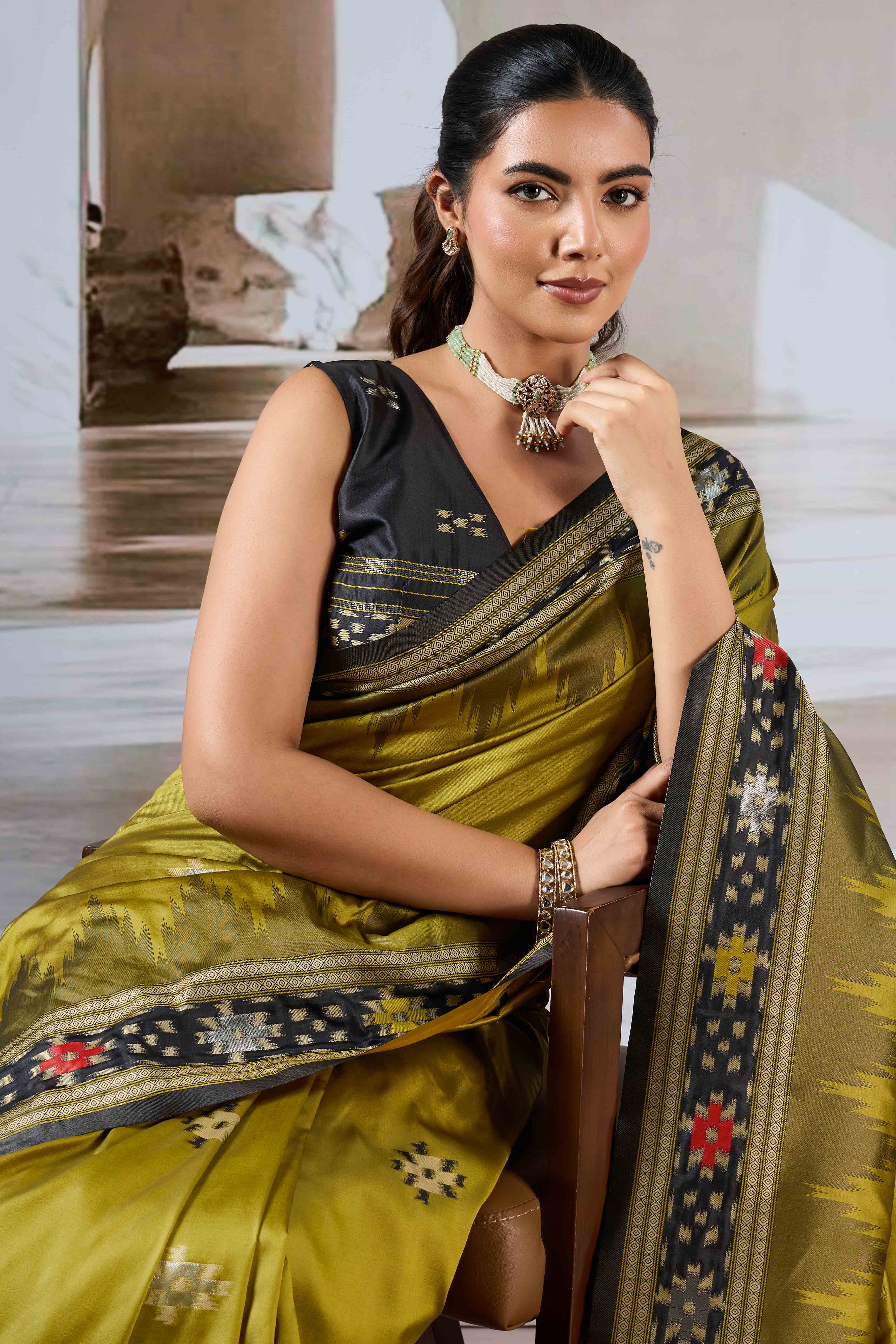 Olive Art Silk Saree Adorned with Intricate Patola Style Woven Designs