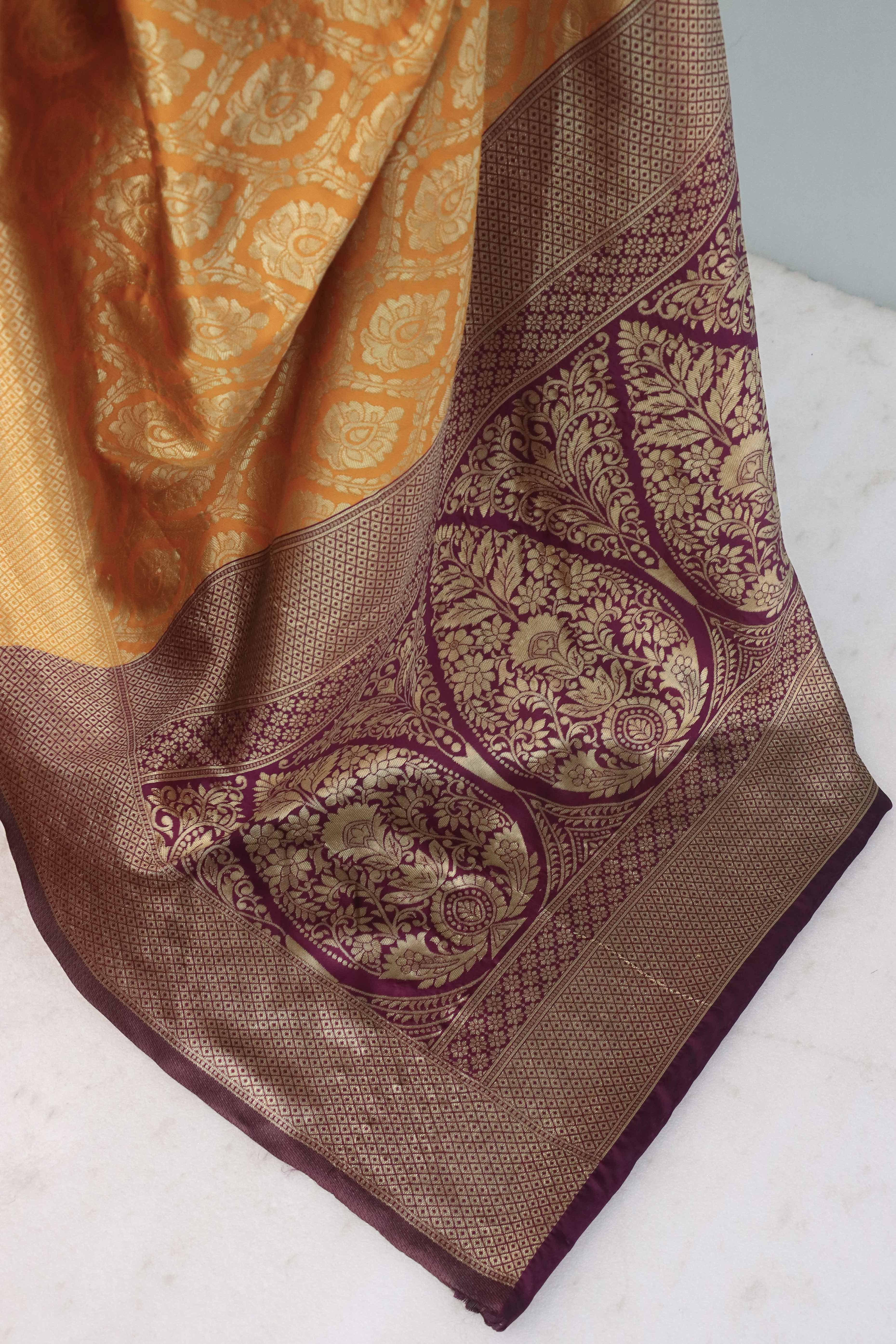 Charming Orange & Purple Banarasi Silk Saree Adorned With Floral Zari Weaving