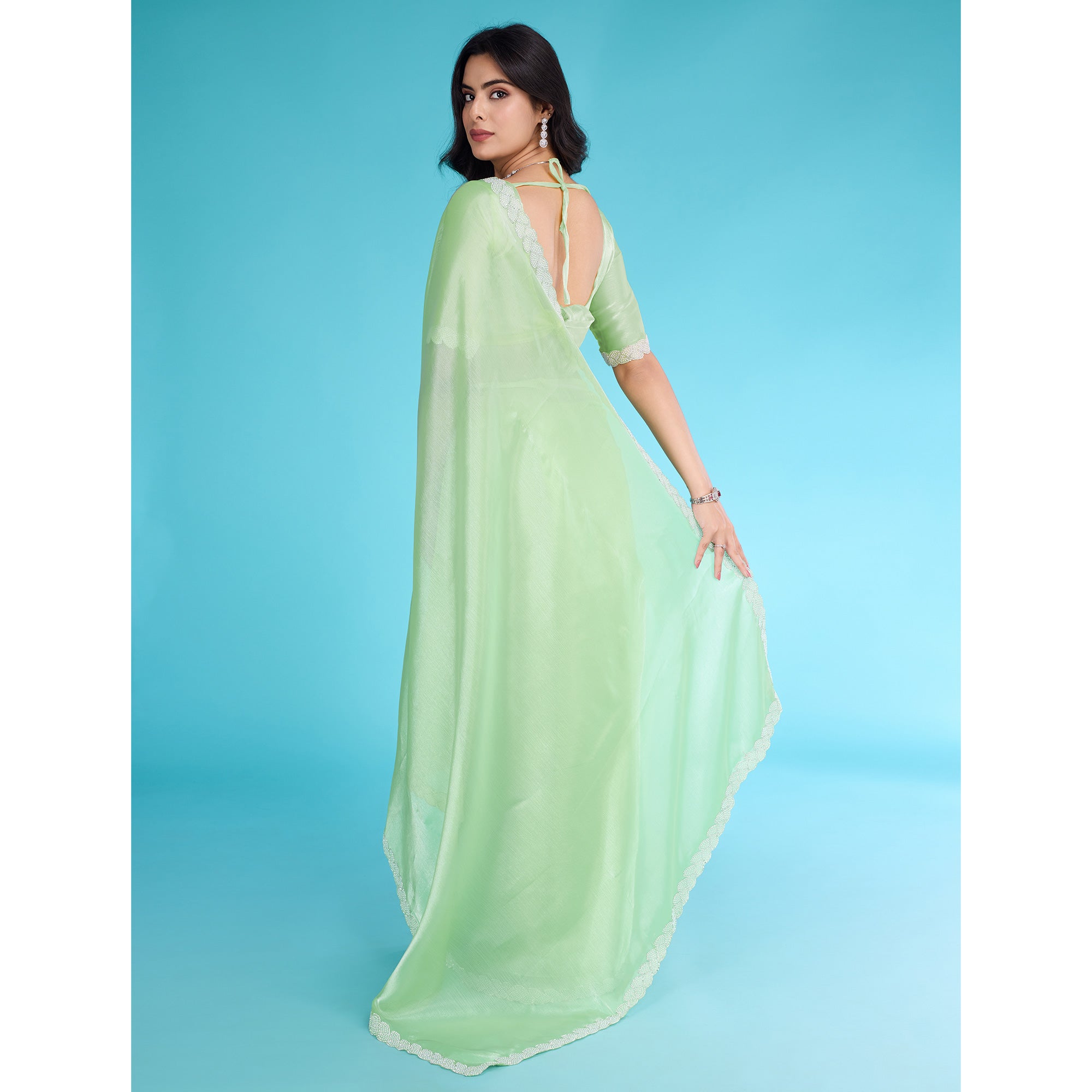 Green Solid With Zarkan & Ceramic Pearl Diamond Lace Tissue Saree