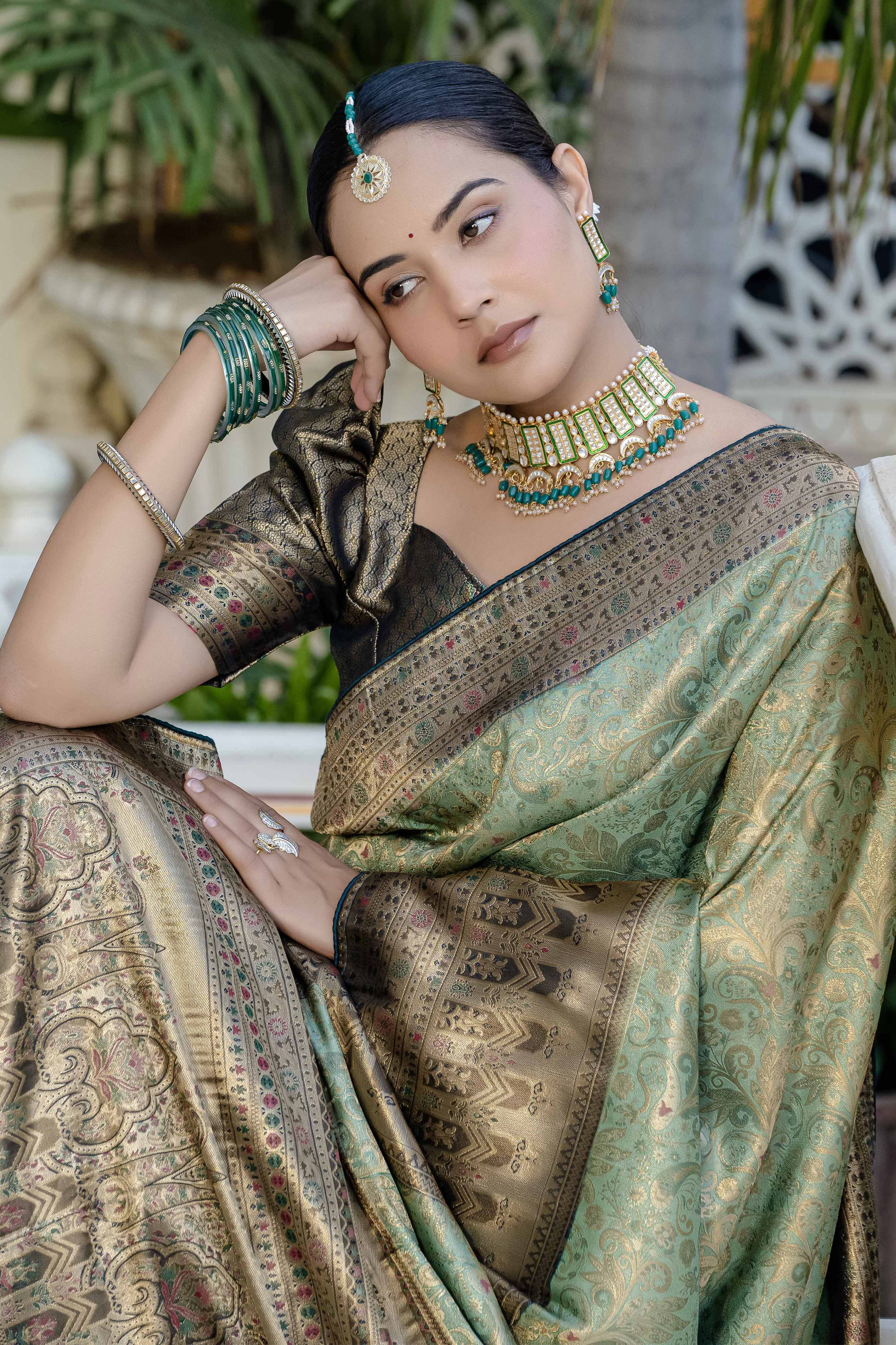 Green Kanjivaram Silk Saree Showcasing Floral Meenakari Zari Weaving With Elegant Piping & Tassels