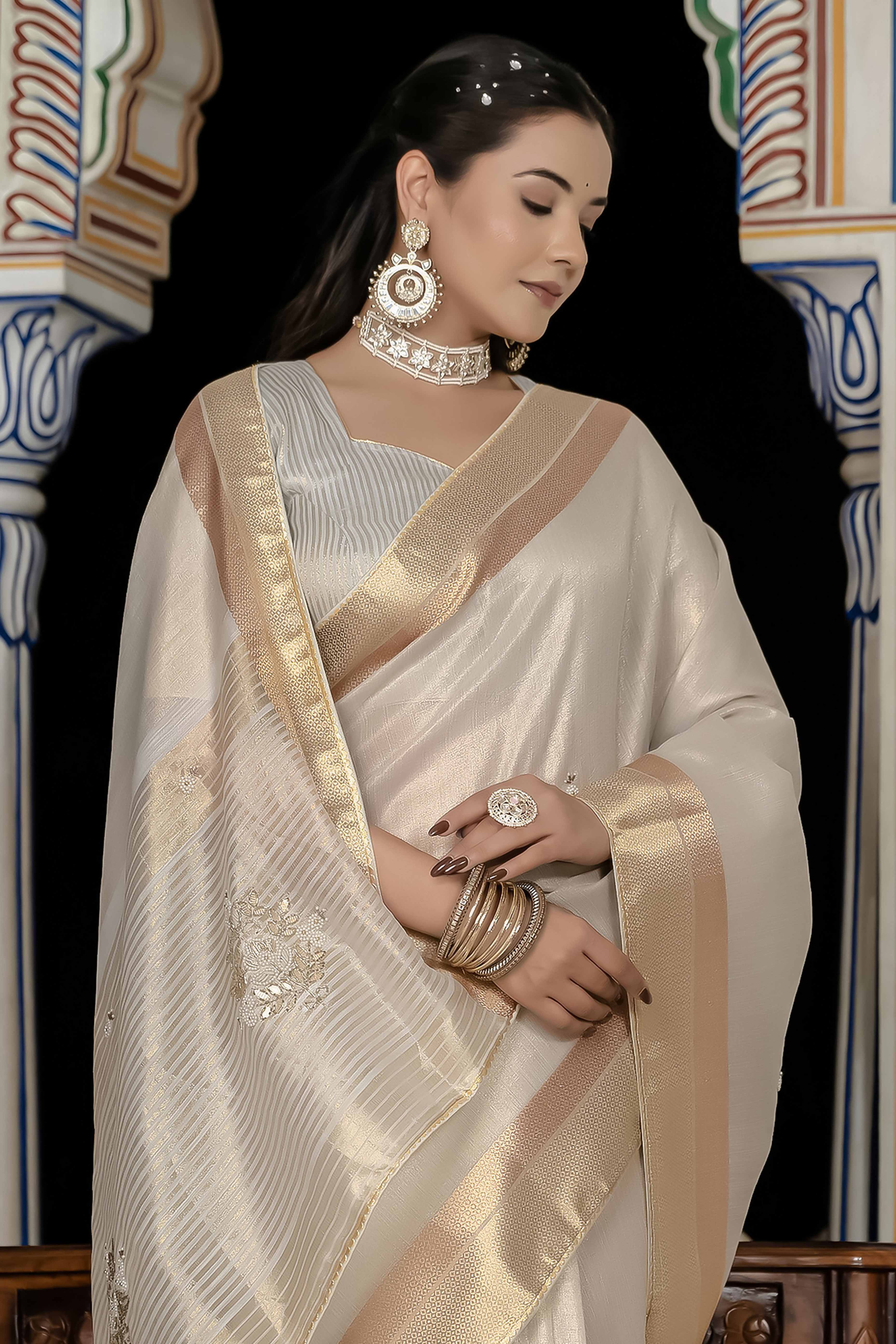 Off White Tissue Linen Saree Featuring Intricate Zari and Beadwork