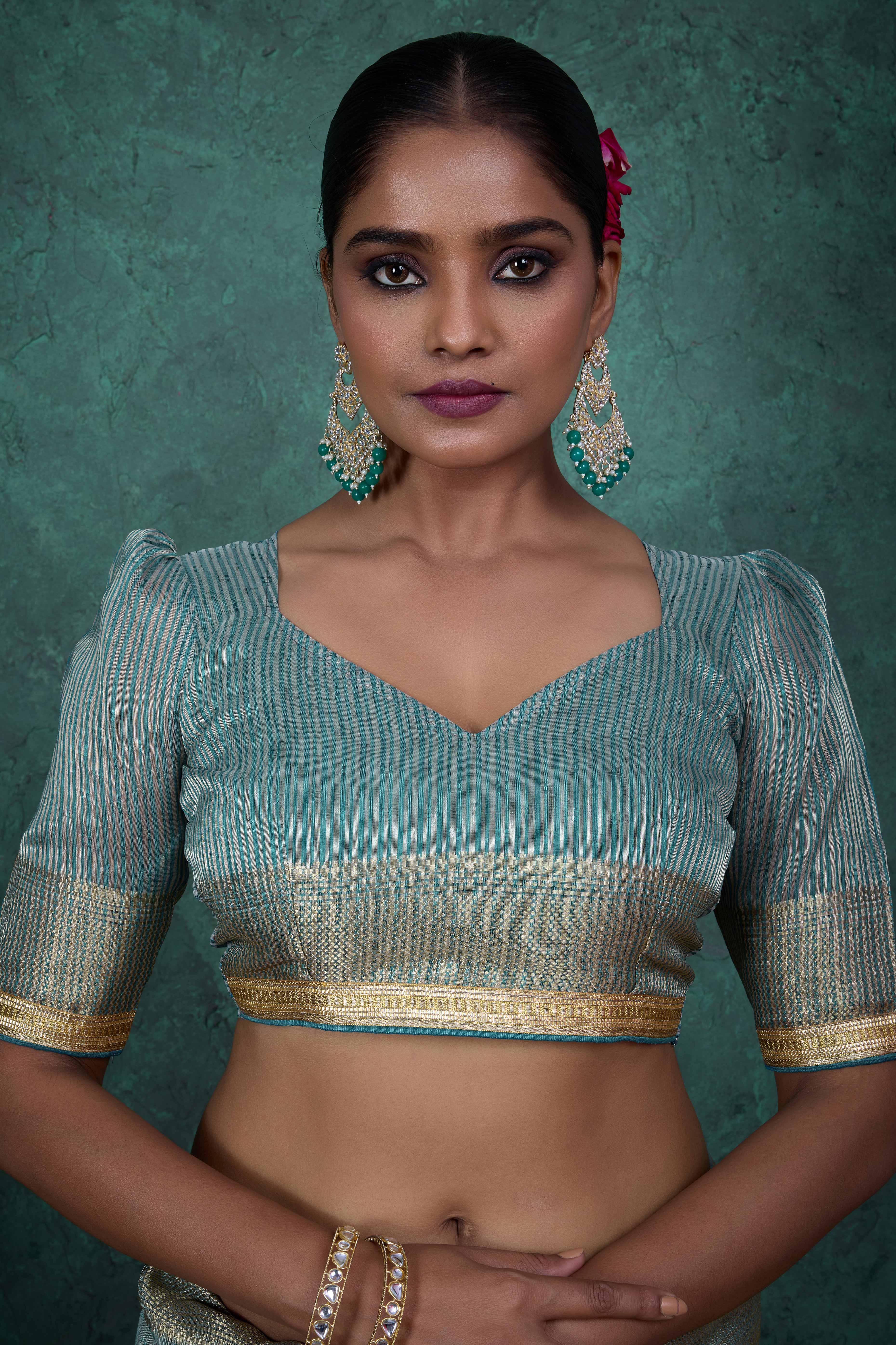 Teal Woven Linen Tissue Saree Featuring Beads Embellishment