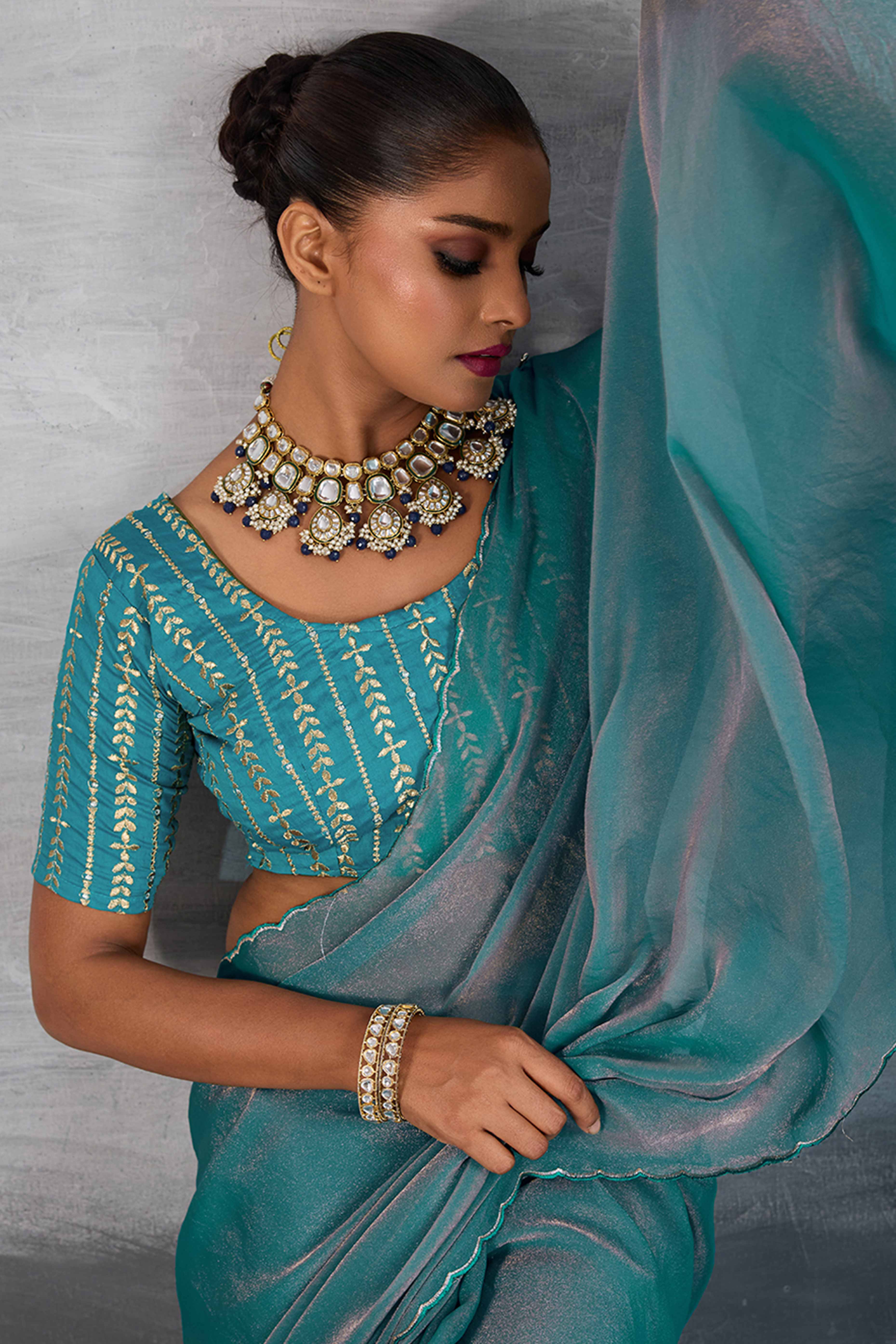 Turquoise Solid Organza Jimmy Choo Saree Accentuated With Elegant Cutwork Border Detailing