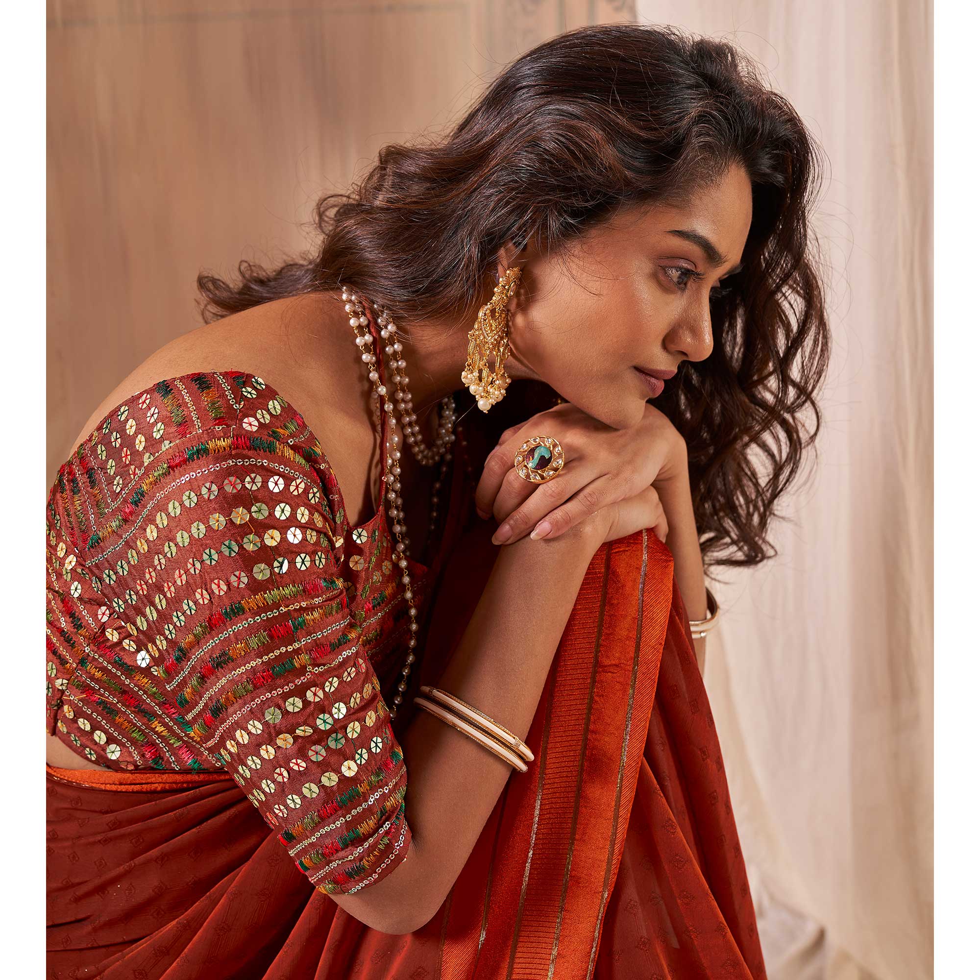 Rust Woven Georgette Saree With Tassels