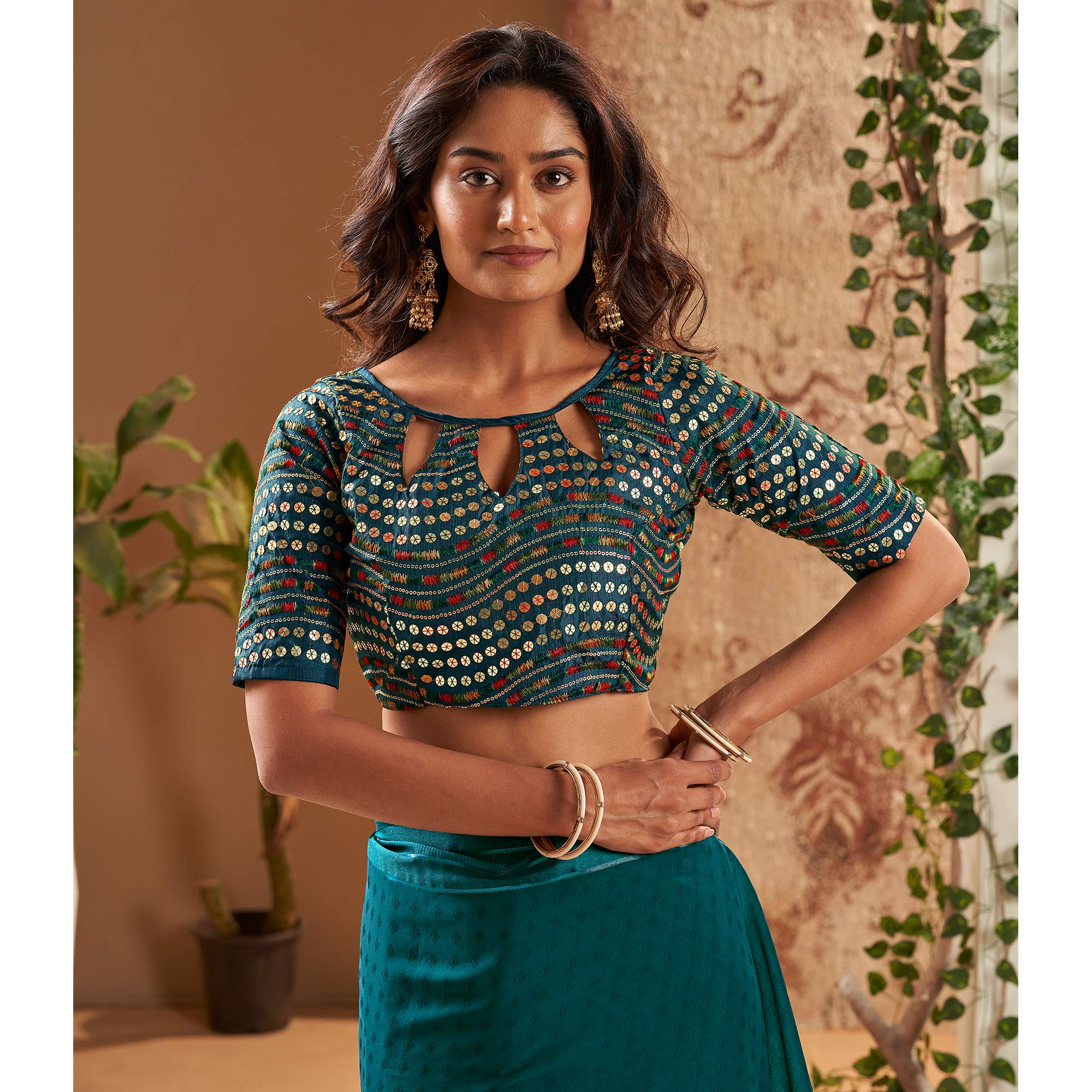 Teal Woven Georgette Saree With Tassels