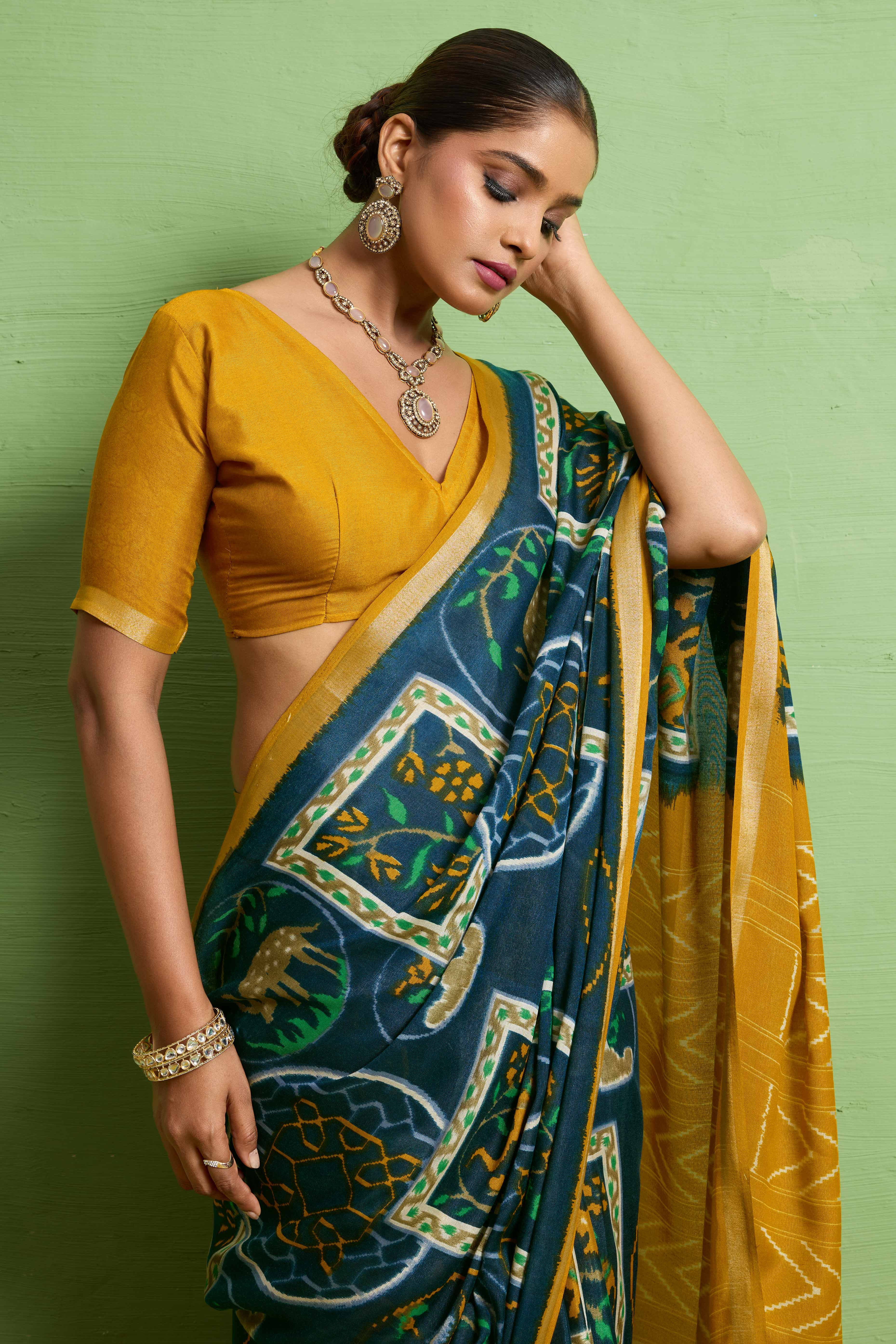 Traditional Morpich Blue Silk Blend Saree with Ikkat Print & Zari Edging