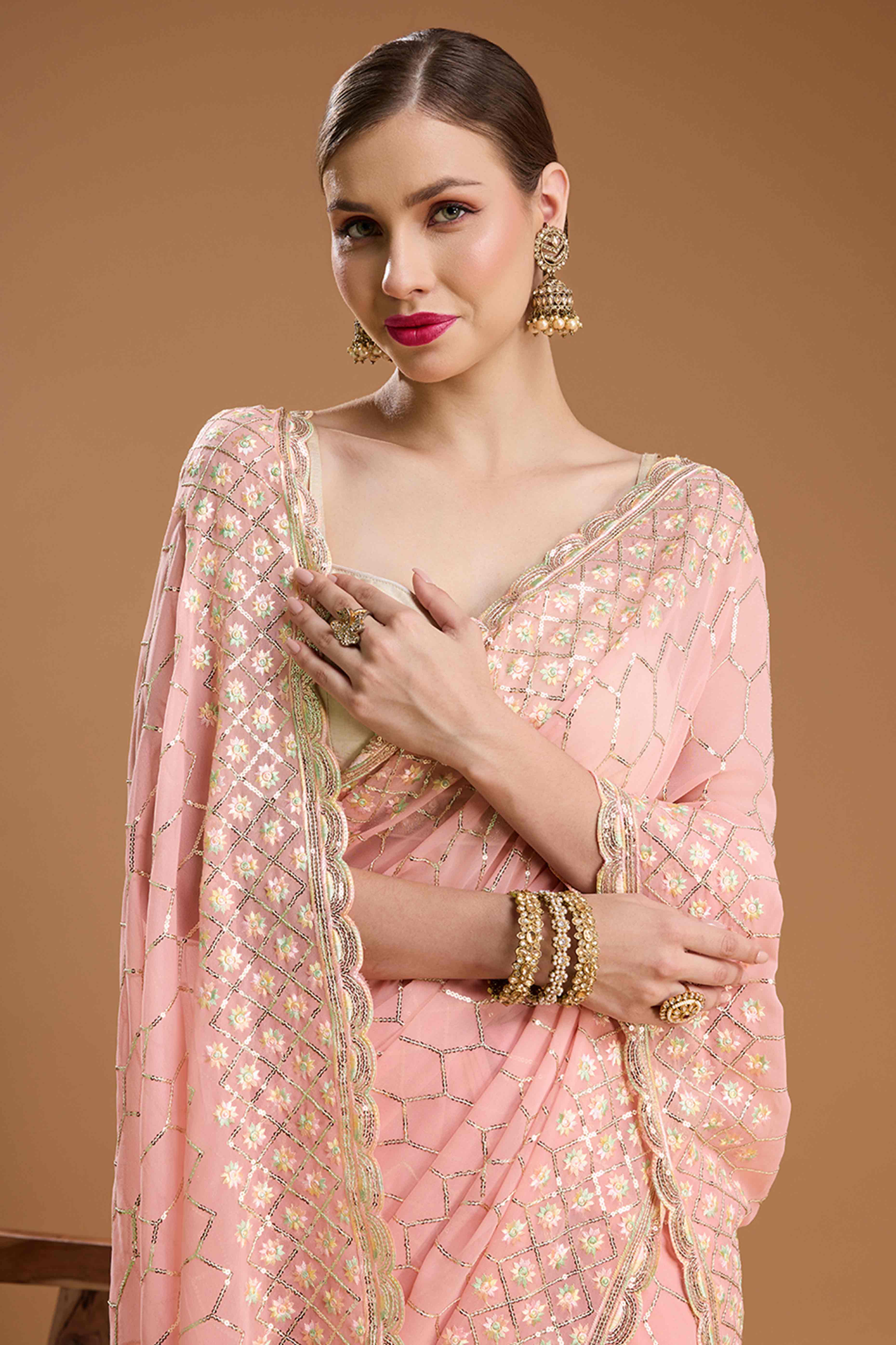 Pastel Peach Georgette Saree Enhanced with Elegant Sequins Embellishments