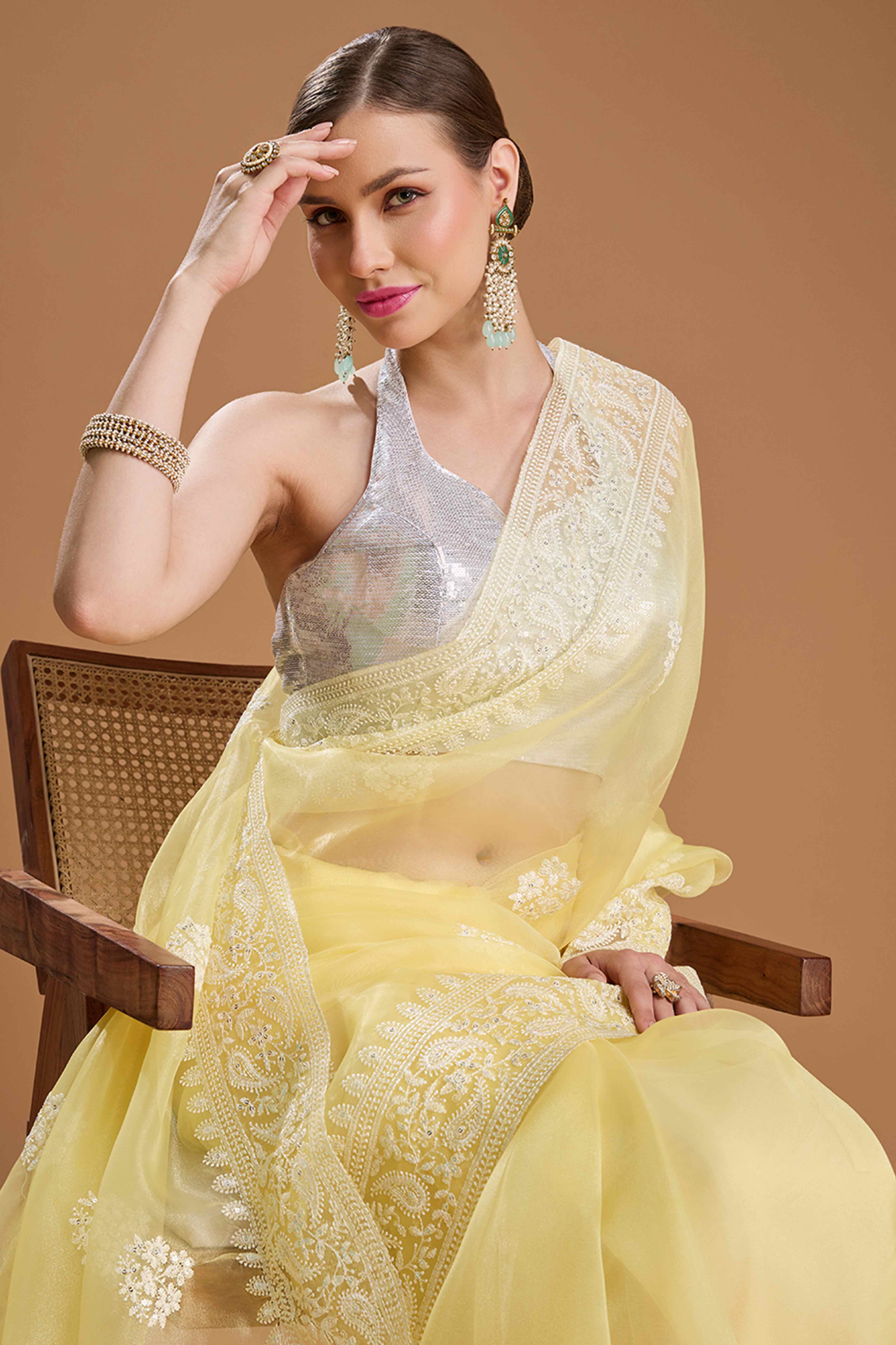 Light Yellow Net Saree Enhanced with Elegant Sequins Embellishments