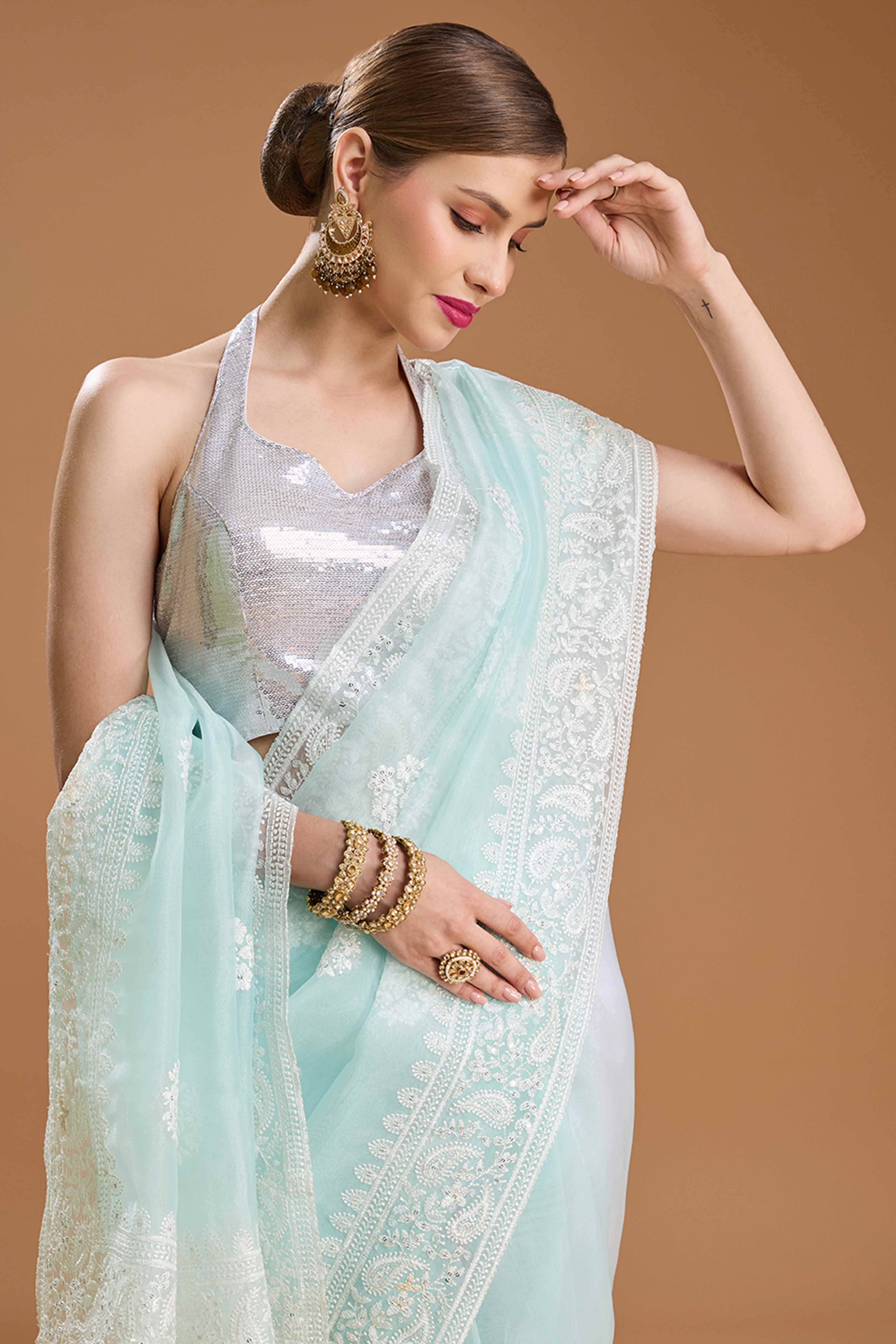 Mint Green Net Saree Enhanced with Elegant Sequins Embellishments