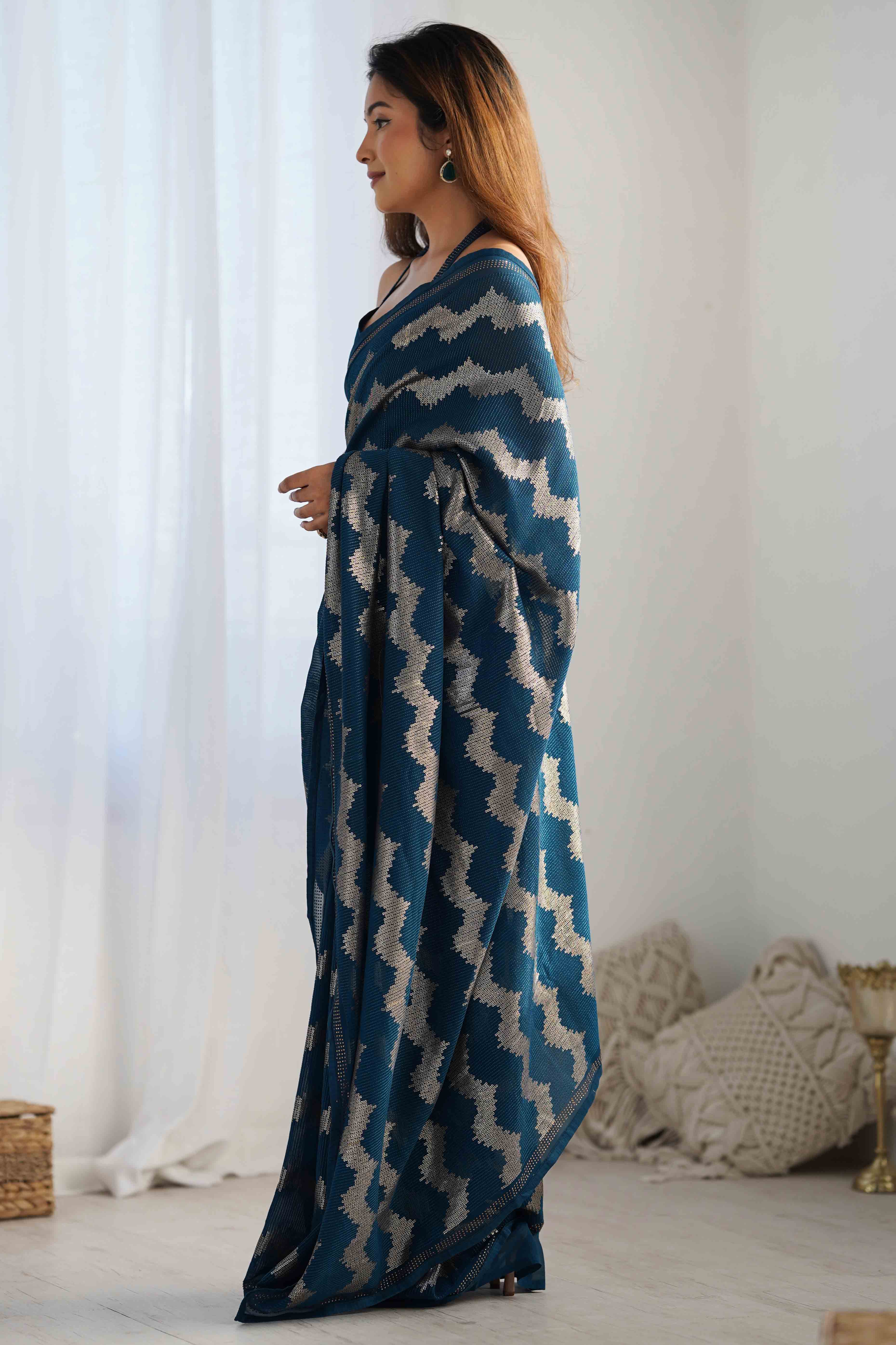 Teal Sequins Embroidered Georgette Saree