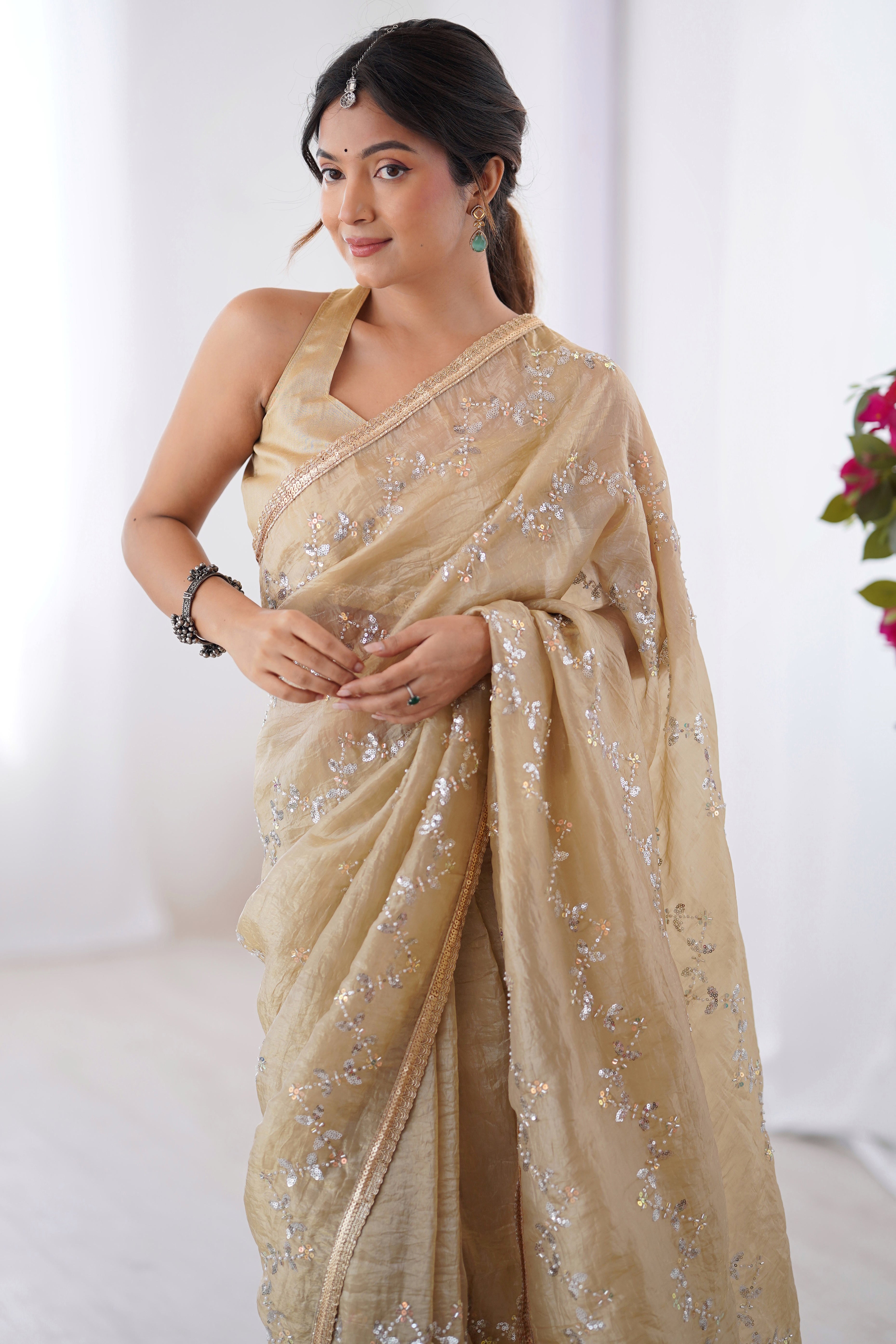 Dazzling Beige Organza Saree Accented with Sequin, Bead & Stone Work and Delicate Lace Detailing