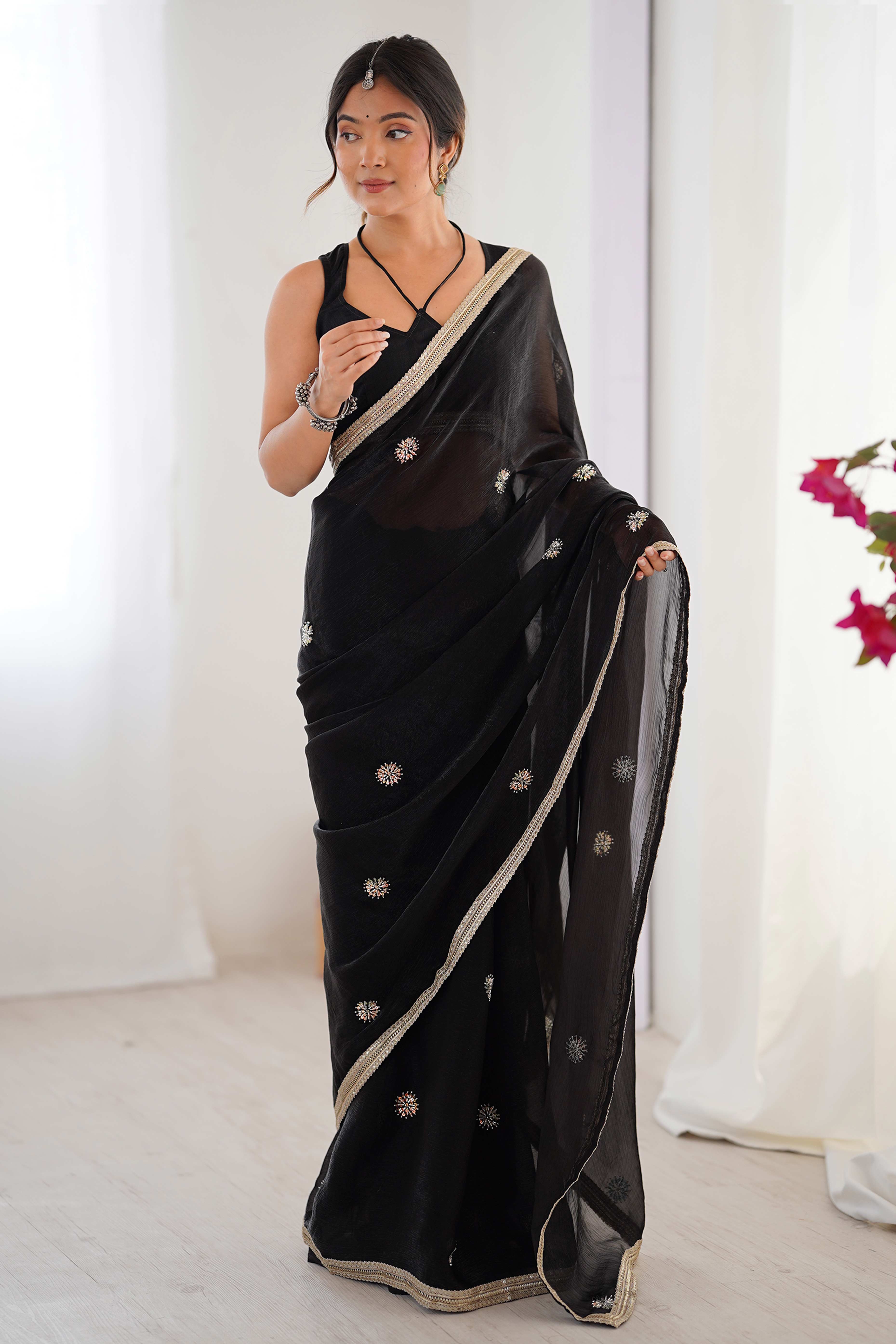 Elegant Black Organza Saree with Delicate Floral Embellishments and Lace Border