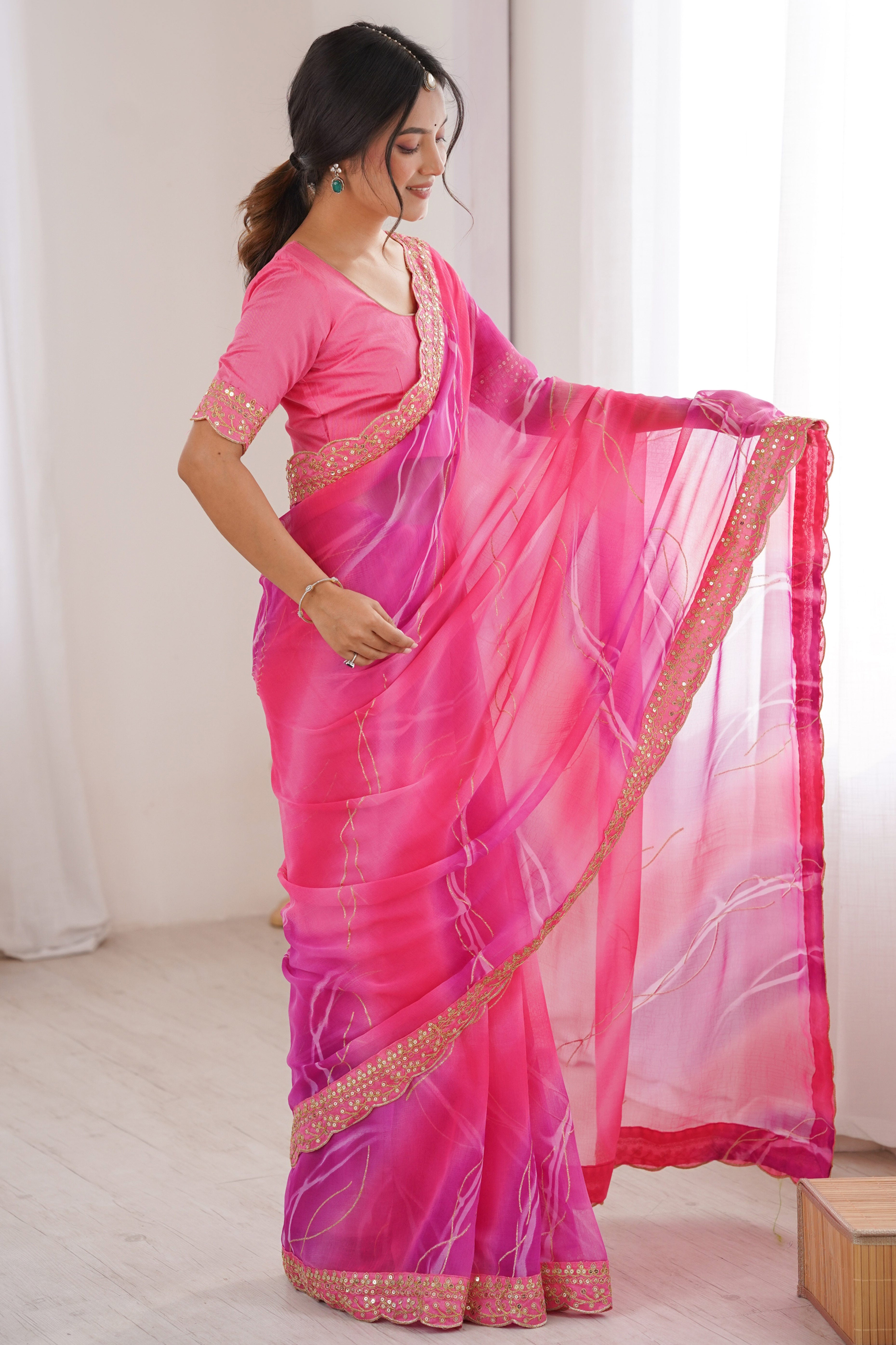 Graceful Pink Foil Print Georgette Saree Featuring A Luxurious Cording Sequins Embroidered Border