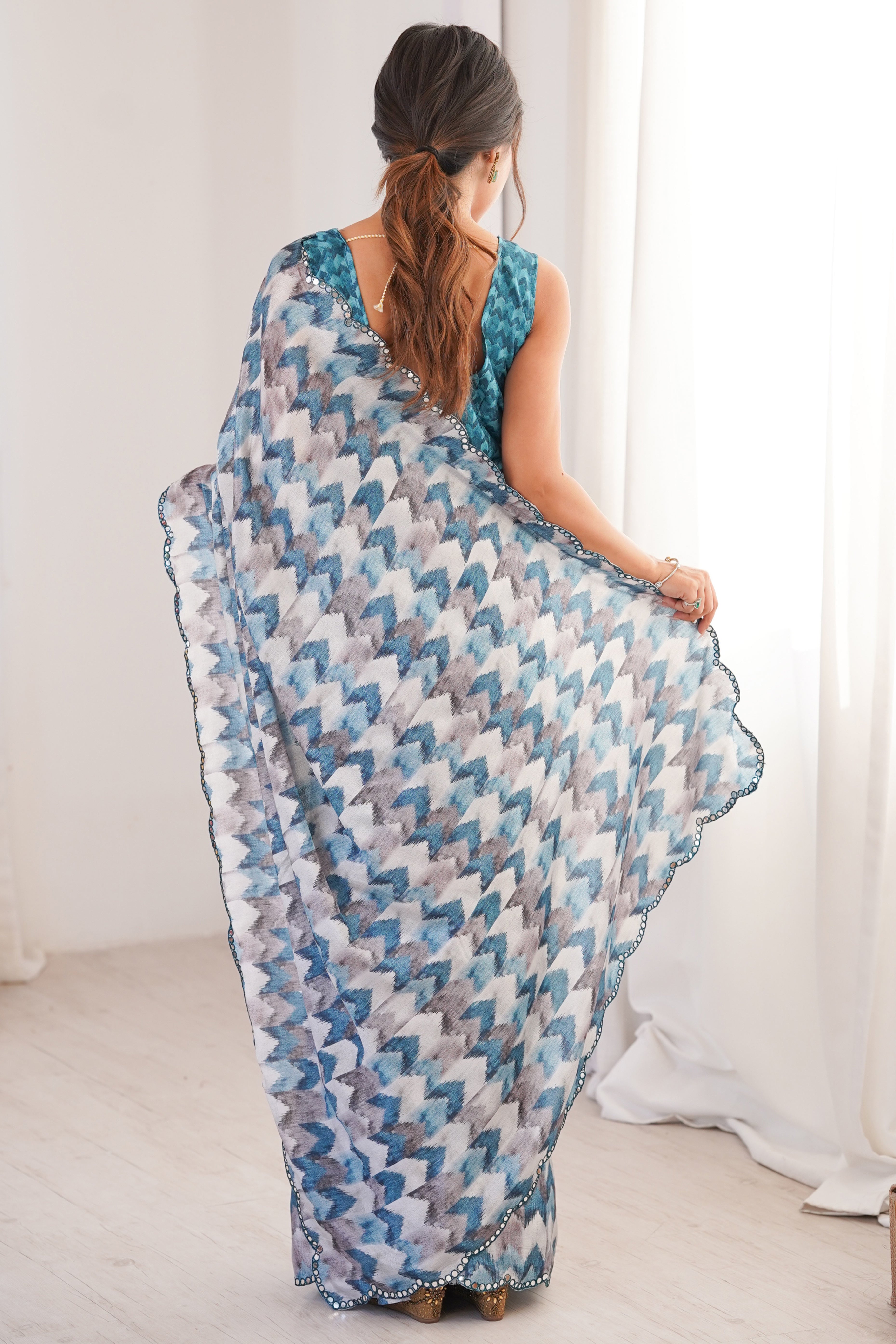 Elegant White Floral Digital Printed Chinon Saree Accented With Intricate Embroidered Border
