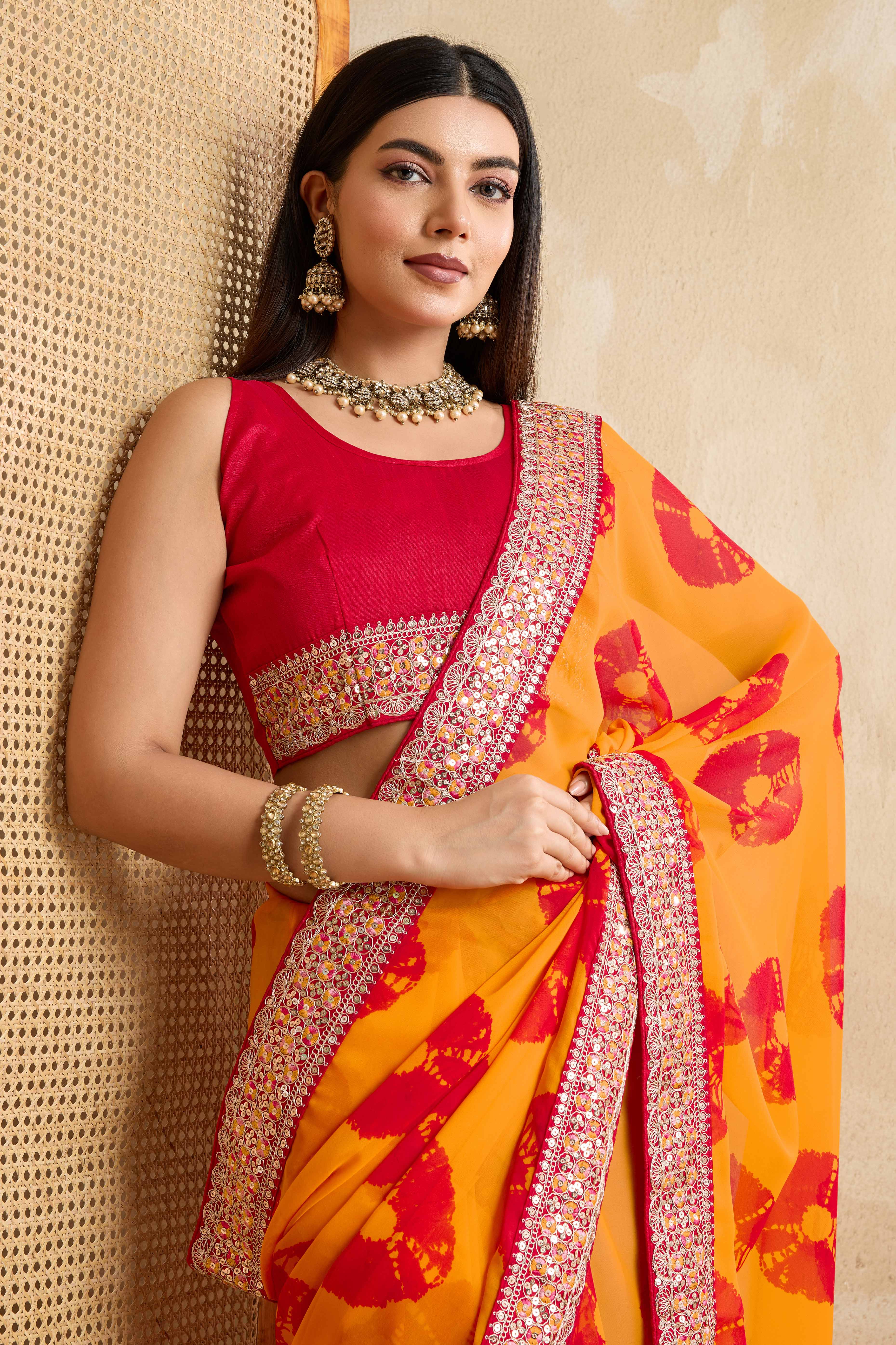 Bright Orange Georgette Saree with Contemporary Tie-Dye Patterns and Classic Lace Work Finish