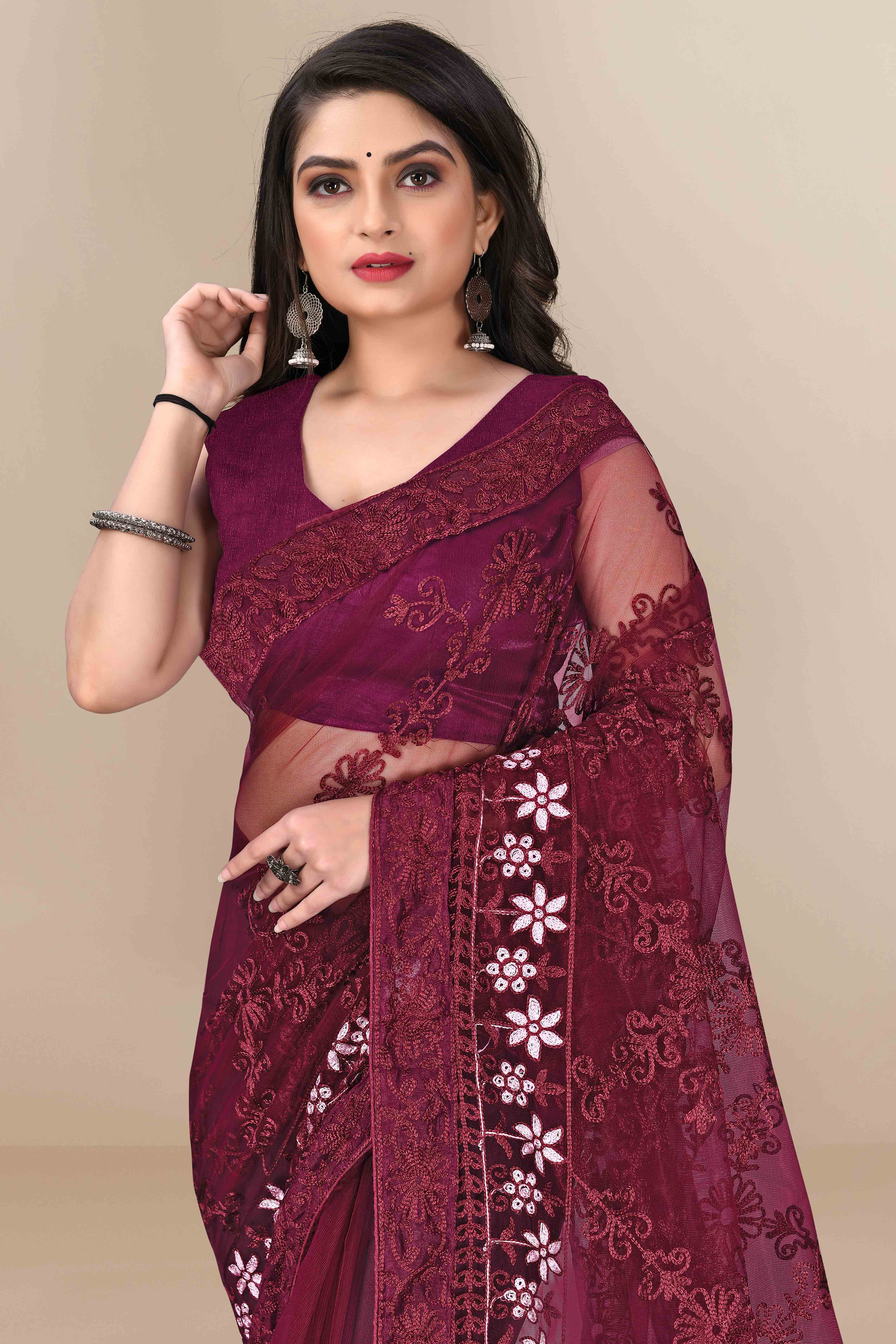Wine Party Wear Net Saree Featuring Rich Floral Embroidery
