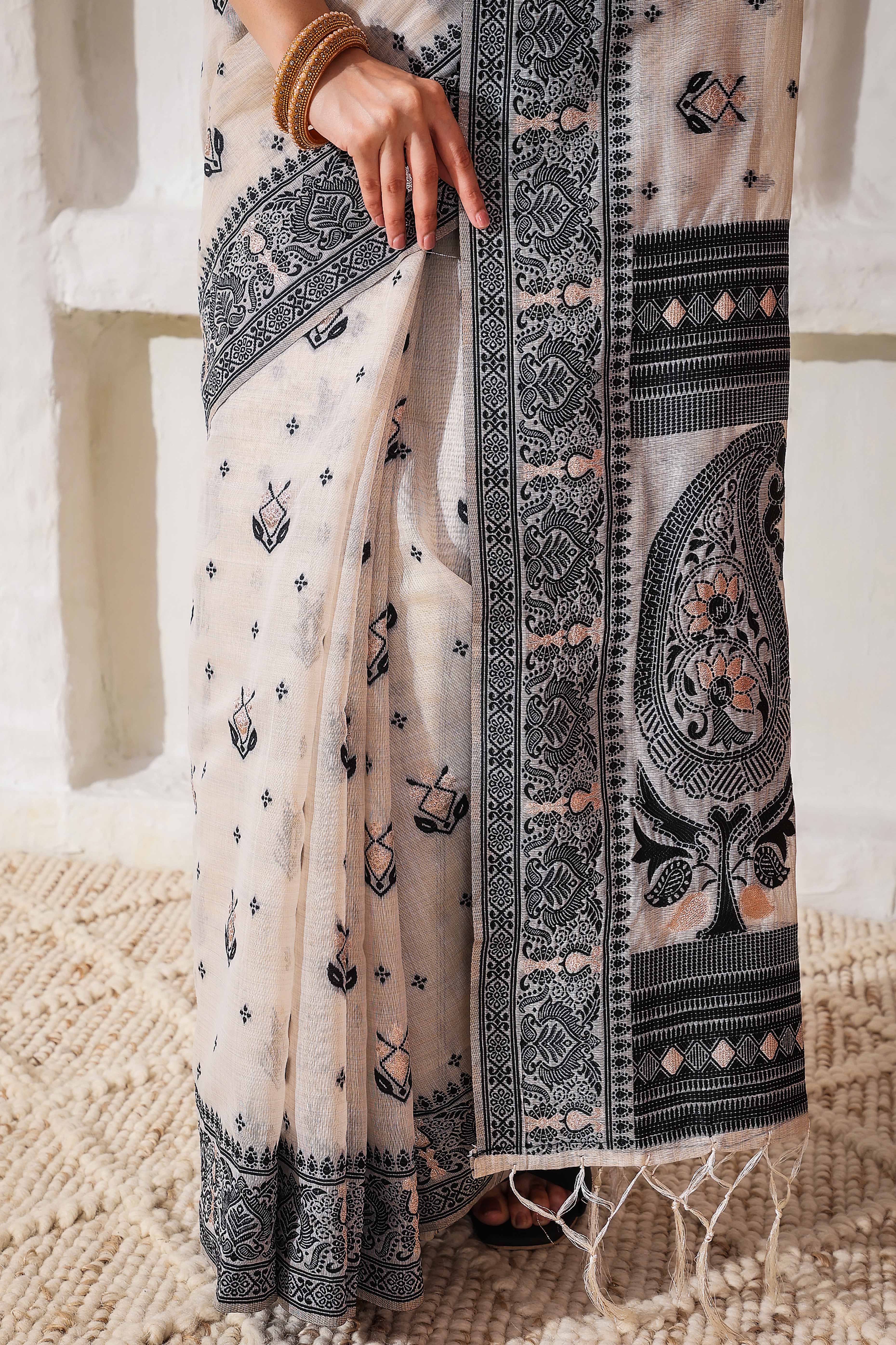 Classic Cream & Black Linen Cotton Saree Featuring Intricate Zari Weaving & Tassel Pallu