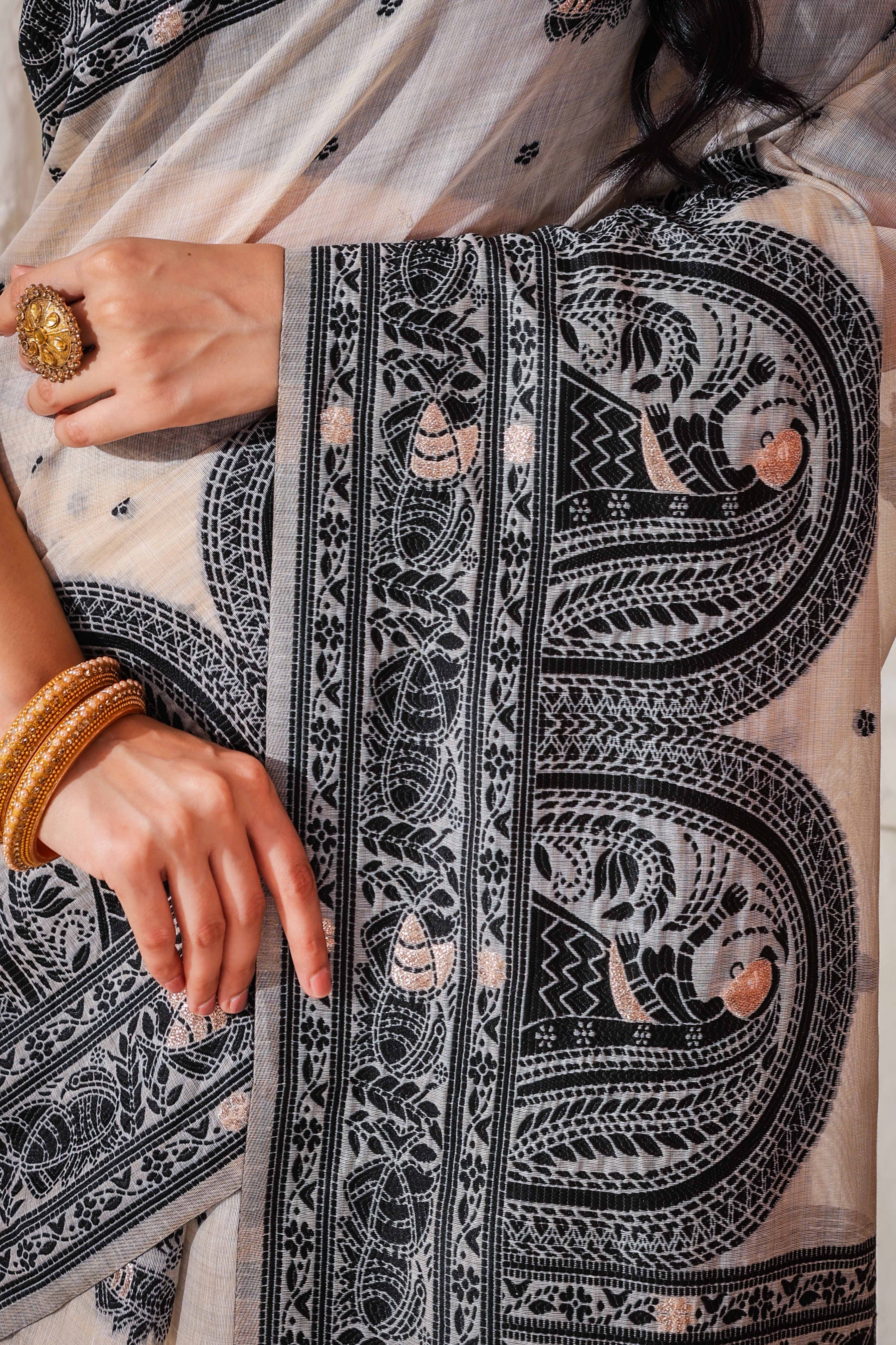 Weaving Cream & Black Linen Cotton Saree Adorned With Graceful Tassel Detailing