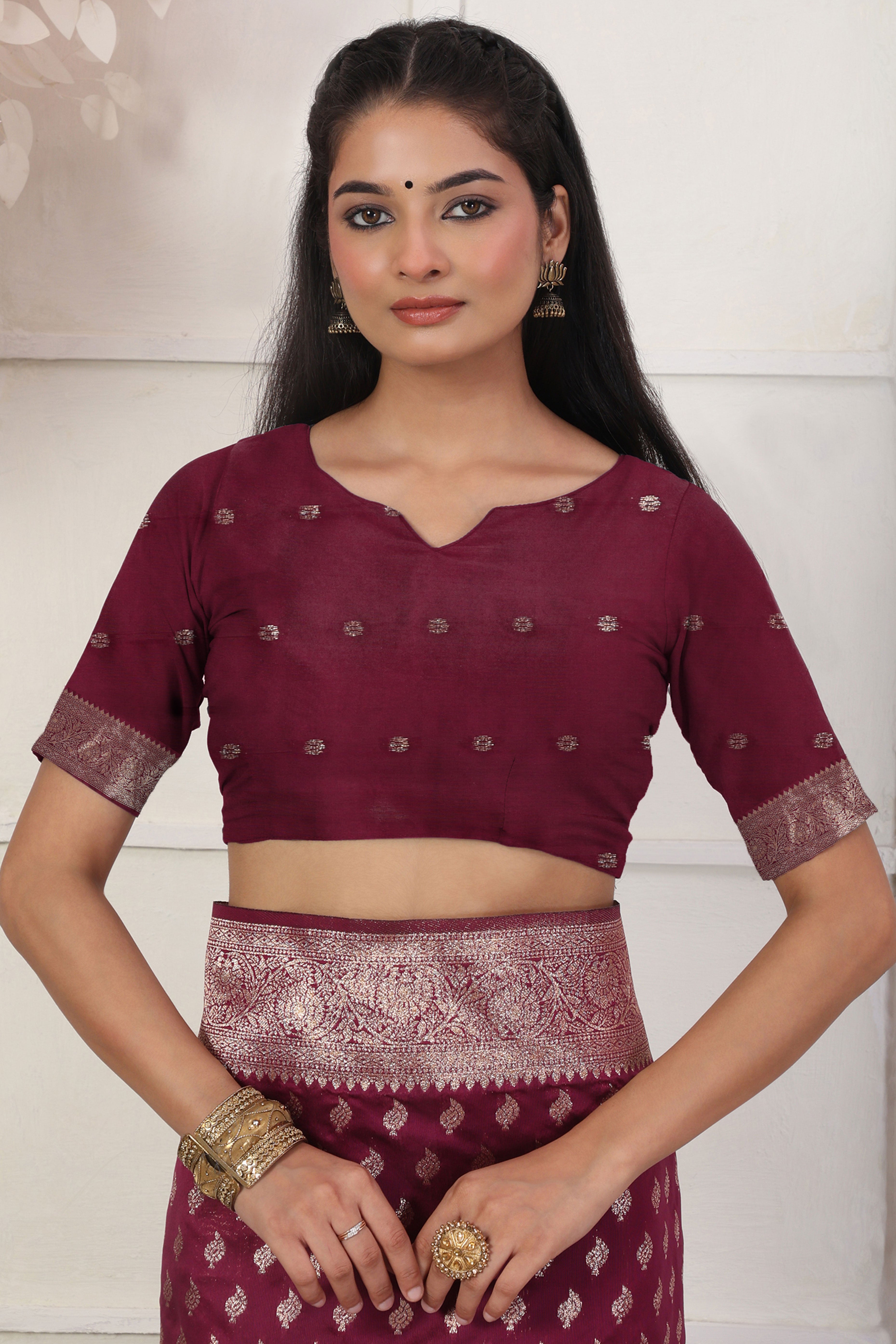 Wine Traditional Lichi Silk Blend Saree Enhanced With Floral Zari Weaving & Tassel Pallu