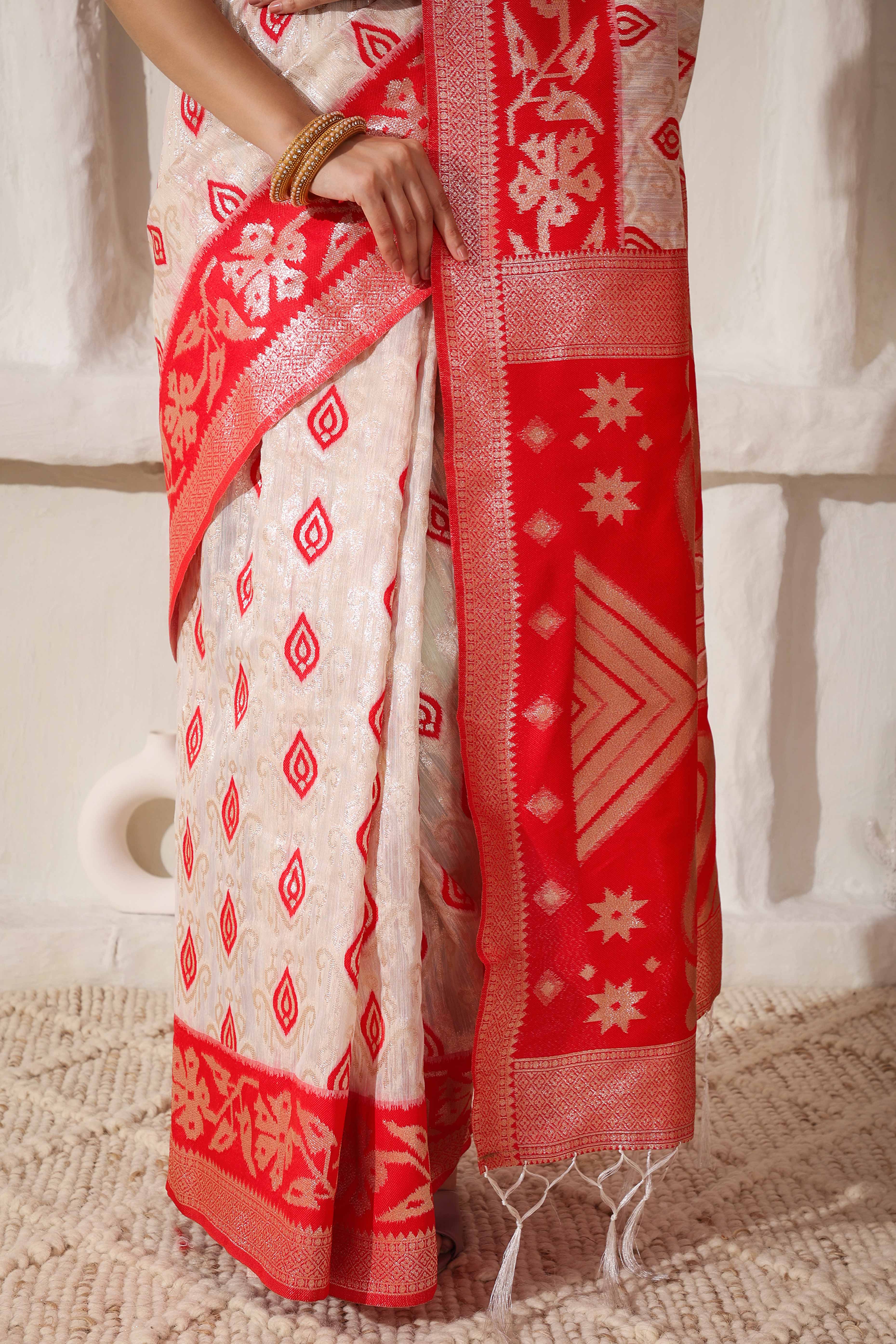Classic White & Red Saree In Linen Cotton With Rich Zari Weaving And Tassel Accents