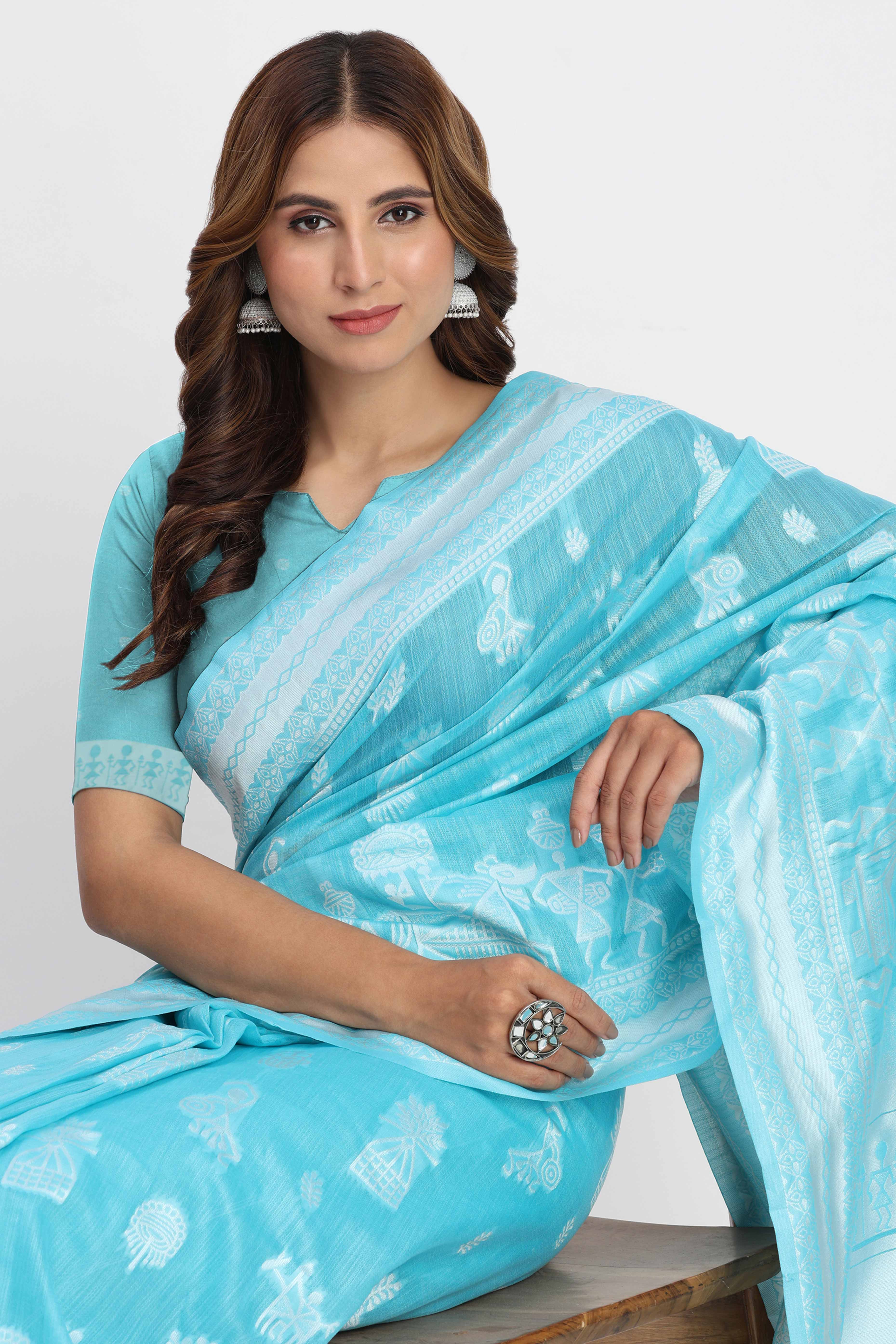 Blue Linen Cotton Saree Showcasing Traditional Warli Motifs In Zari Weaving With Tassel Pallu