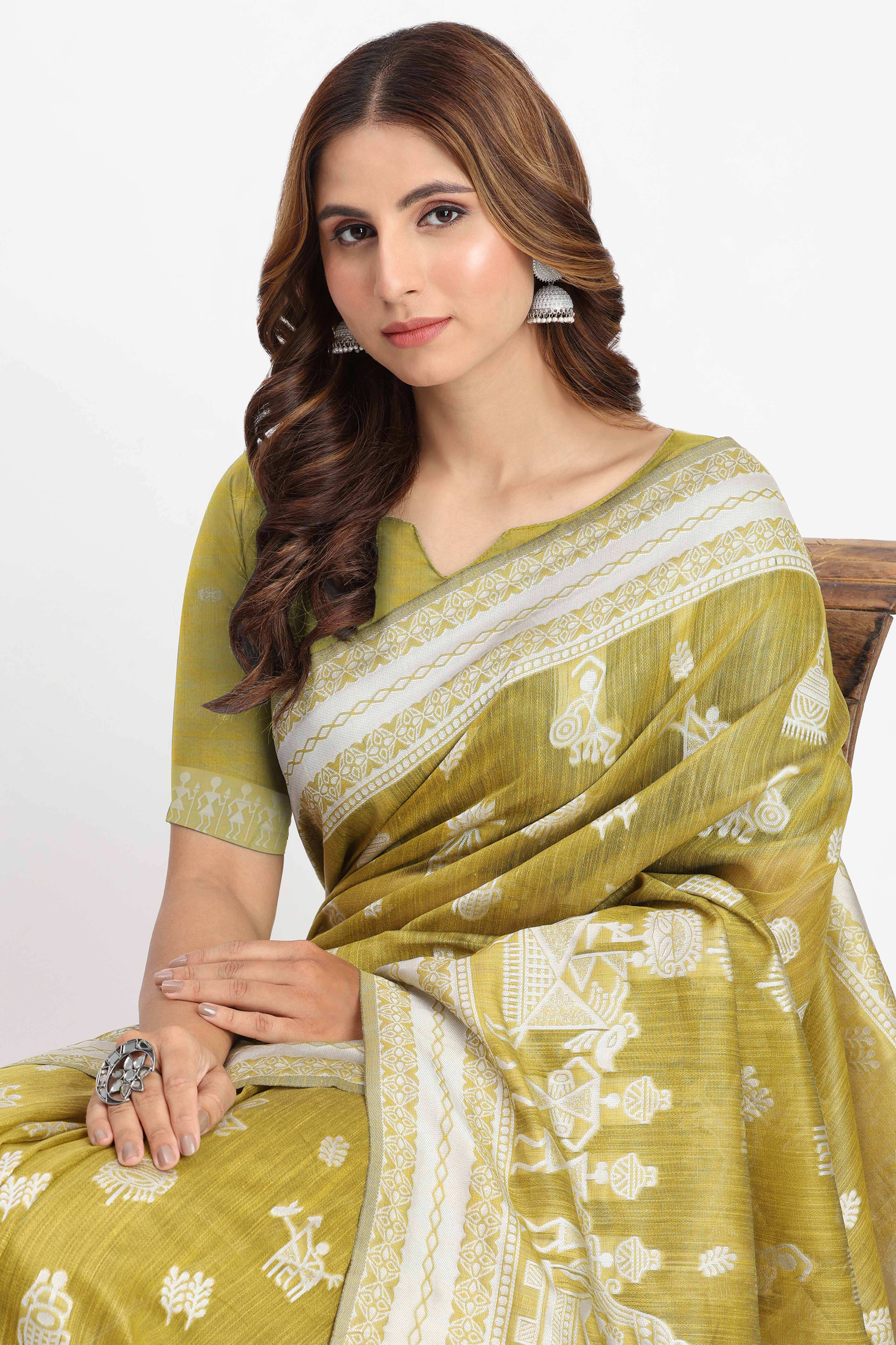 Green Linen Cotton Saree Showcasing Traditional Warli Motifs In Zari Weaving With Tassel Pallu