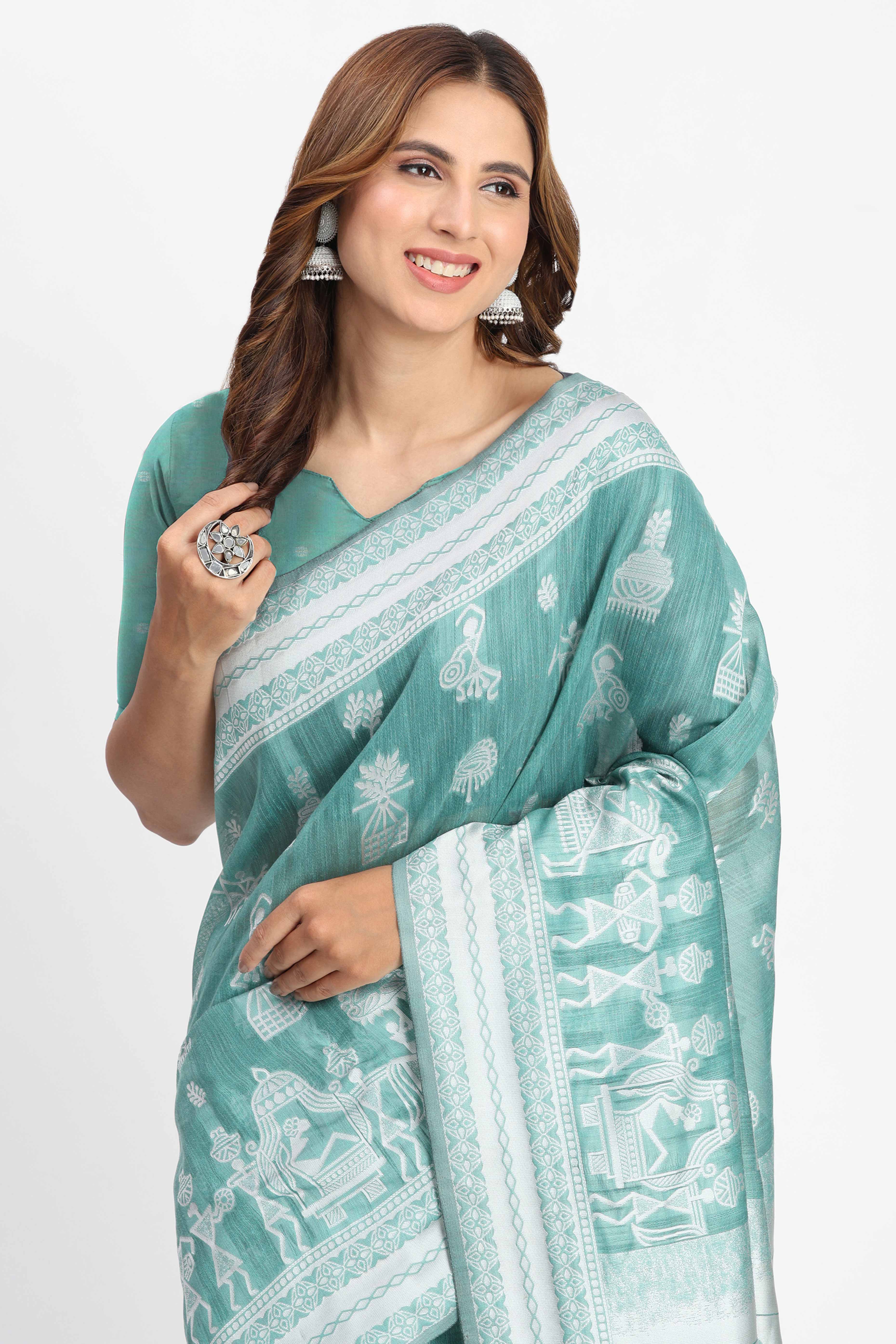 Pastel Sea Green Linen Cotton Saree Showcasing Warli Motifs In Zari Weaving With Tassel Pallu