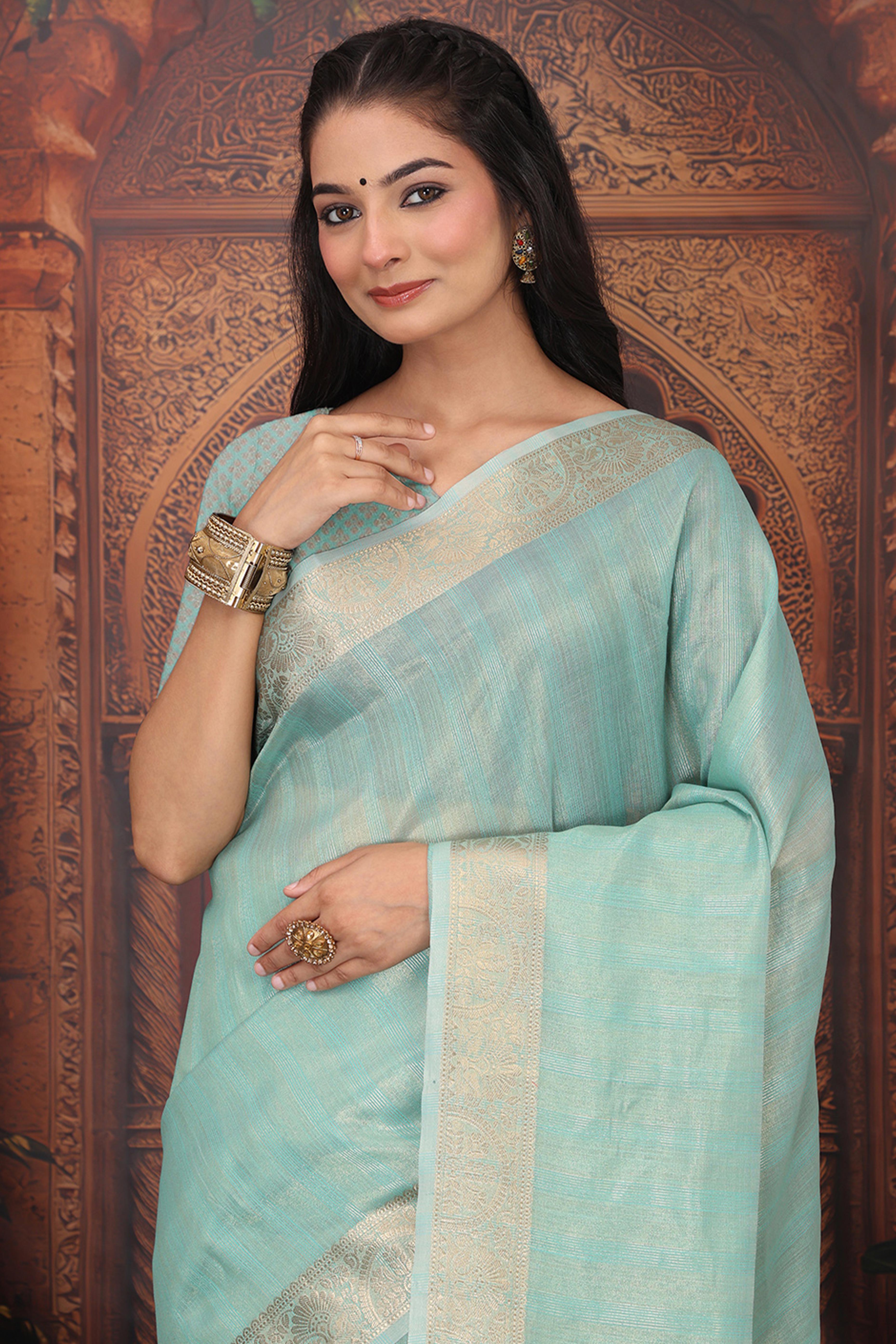 Turquoise Organza Saree Adorned With Floral Zari Weaving & Graceful Tassel Pallu