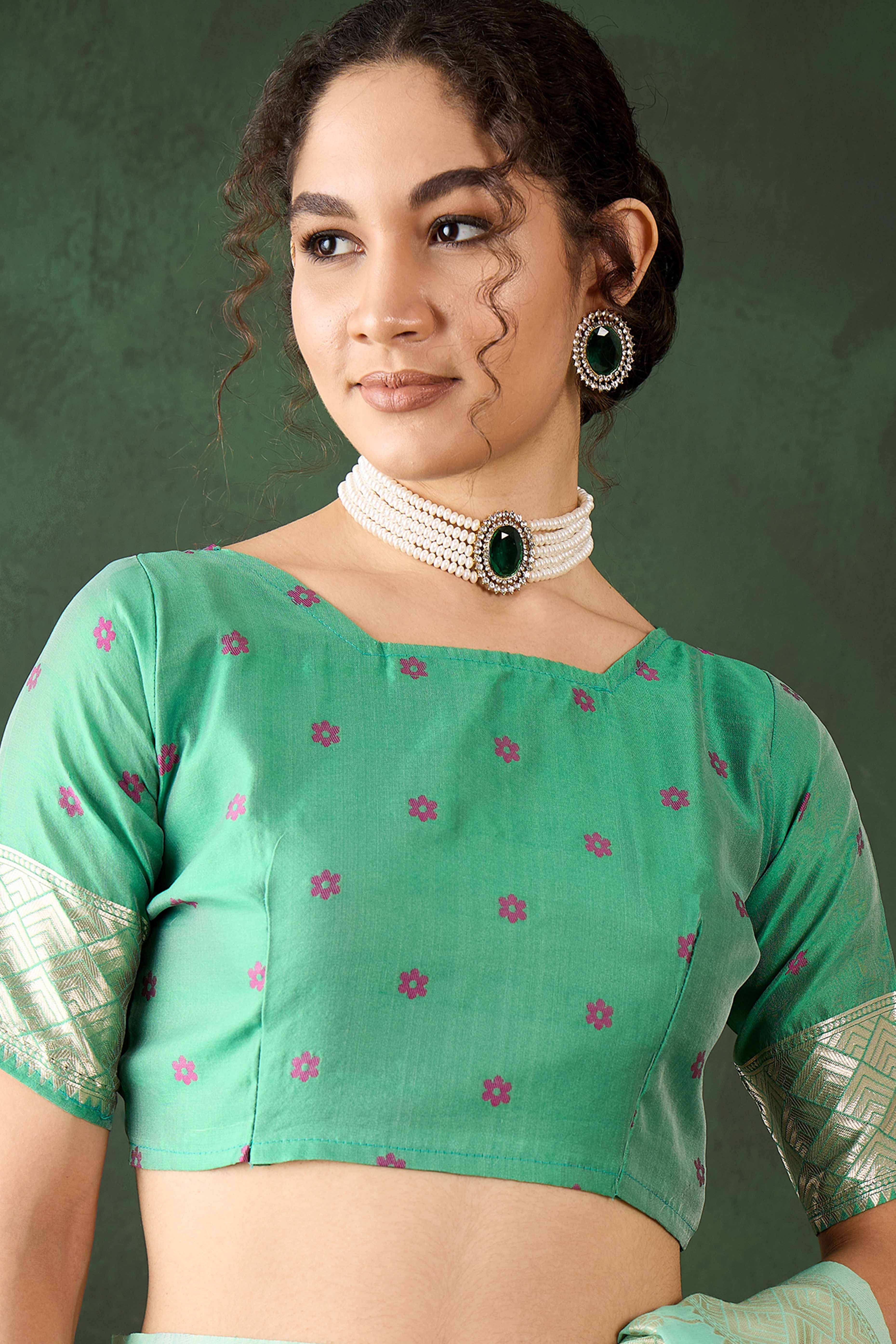 Sea Green Cotton Blend Saree Adorned With Intricate Floral Zari Weaving & A Stylish Tassel Pallu