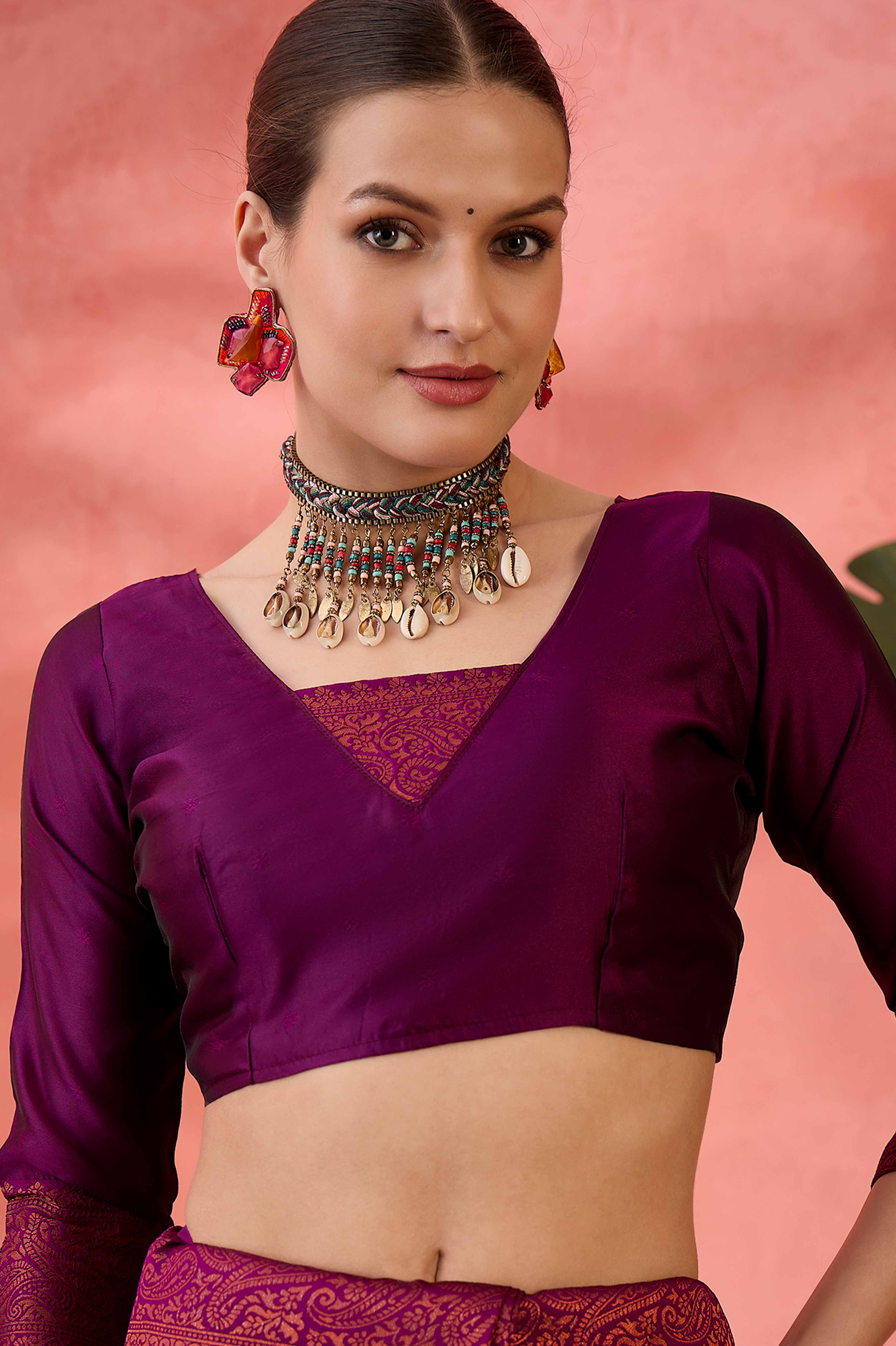 Wine Woven Poly Silk Blend Saree Featuring Floral & Paisley Motifs With Tassel Accents