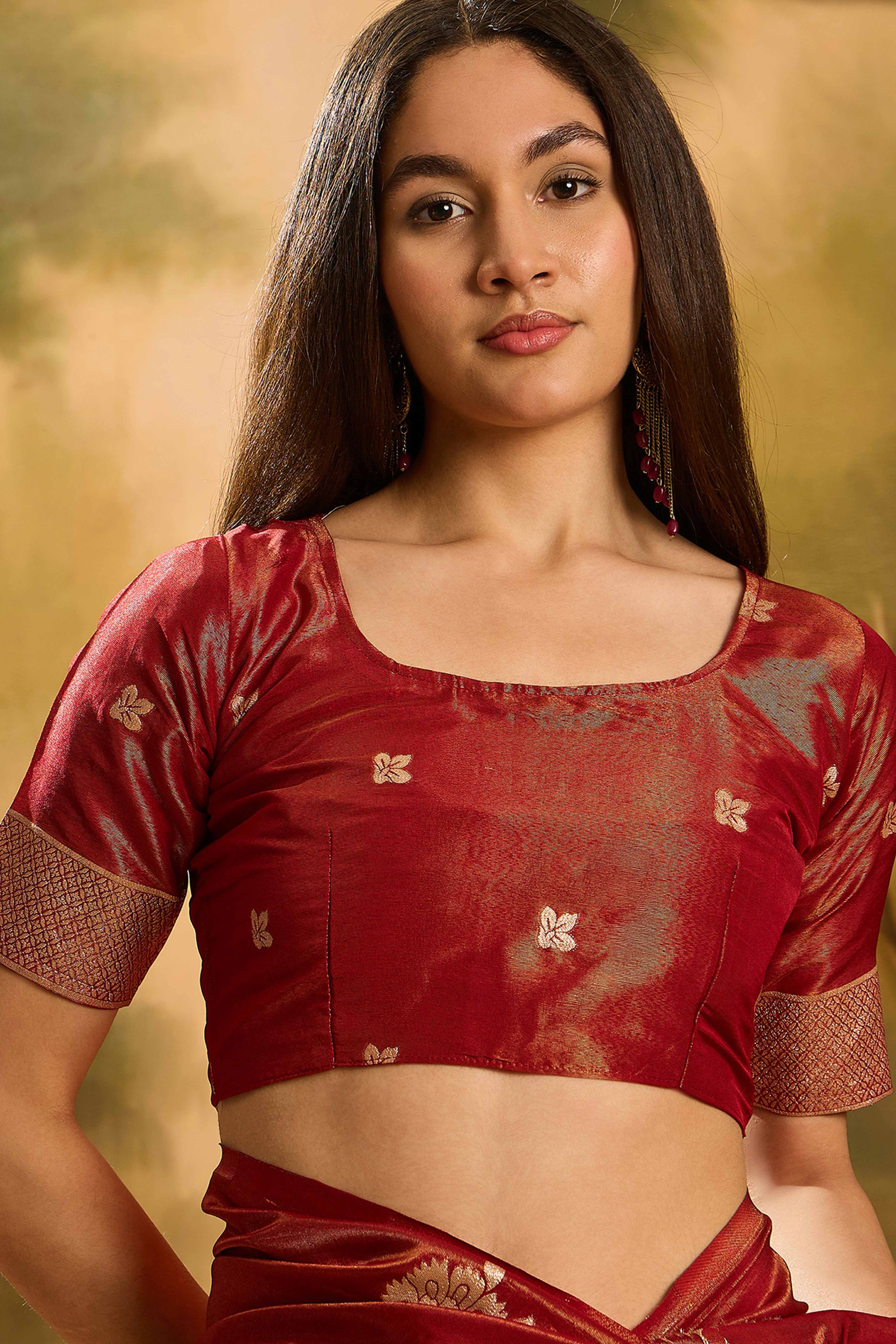Maroon Shimmer Saree Featuring Intricate Floral Zari Weaving & Tassel Finish