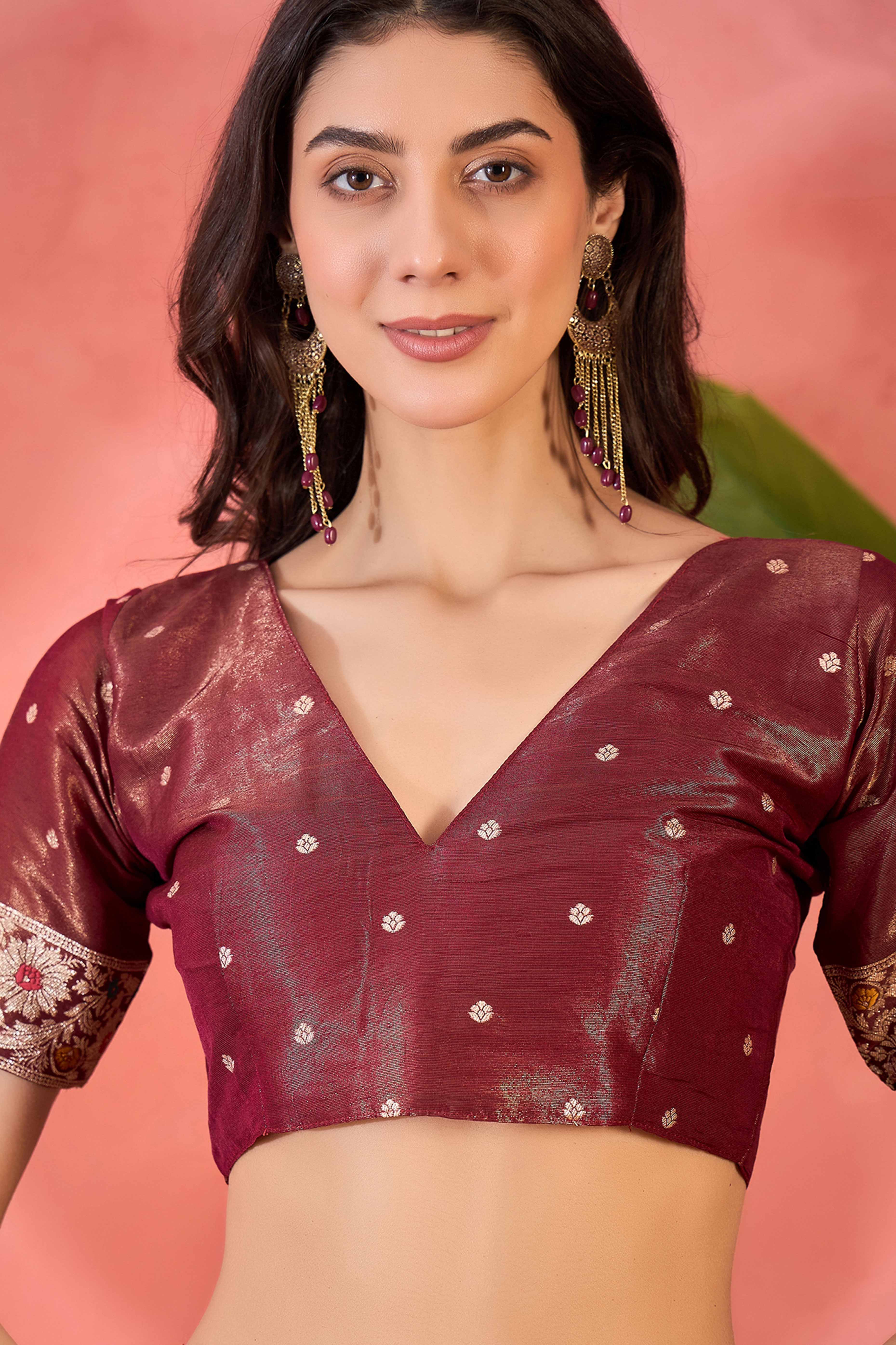 Maroon Zari Woven Shimmer Saree With Floral Motifs & Flowing Tassel Pallu