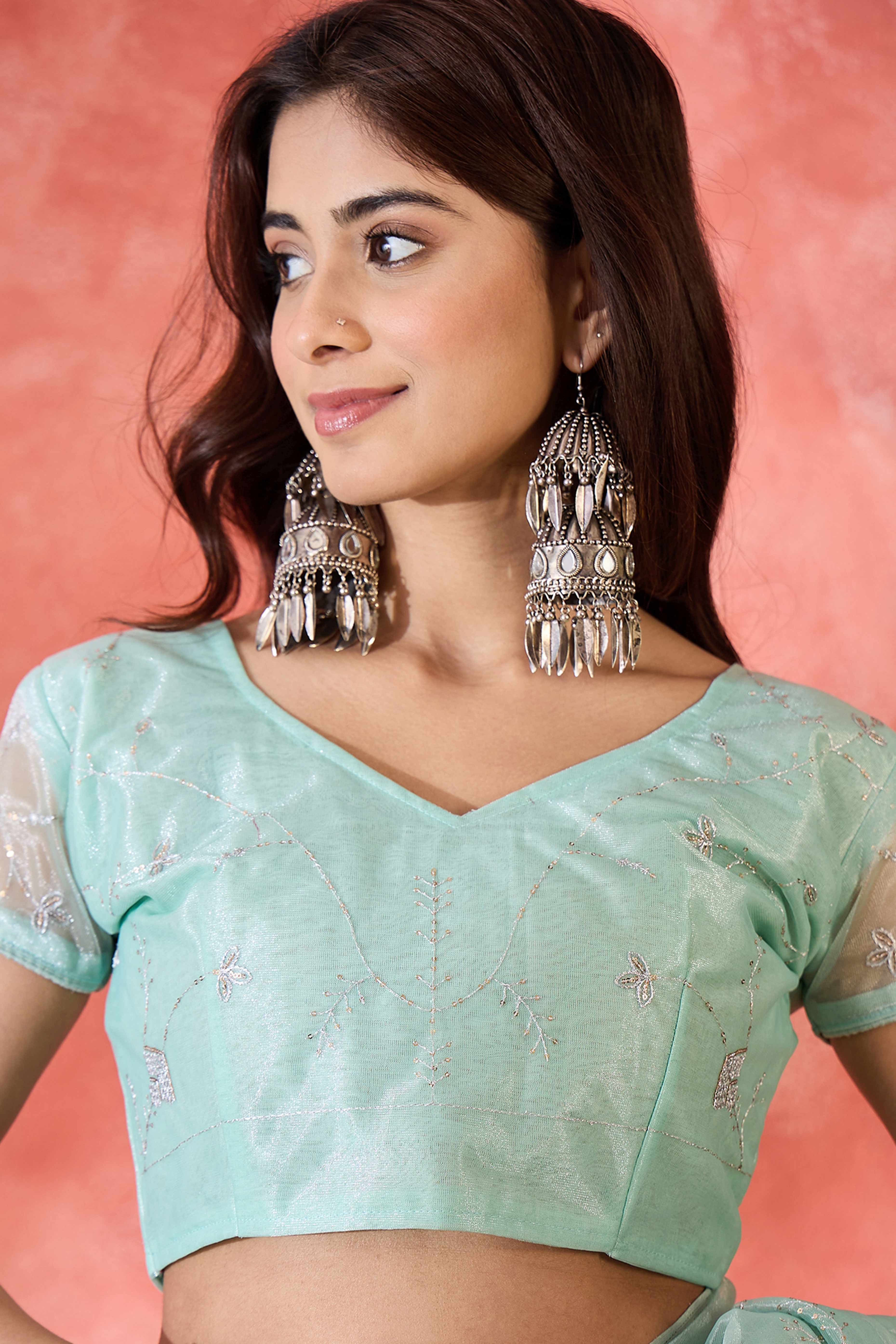 Pale Turquoise Floral Sequin Embellished Saree In Twill Net With Tassel Accents