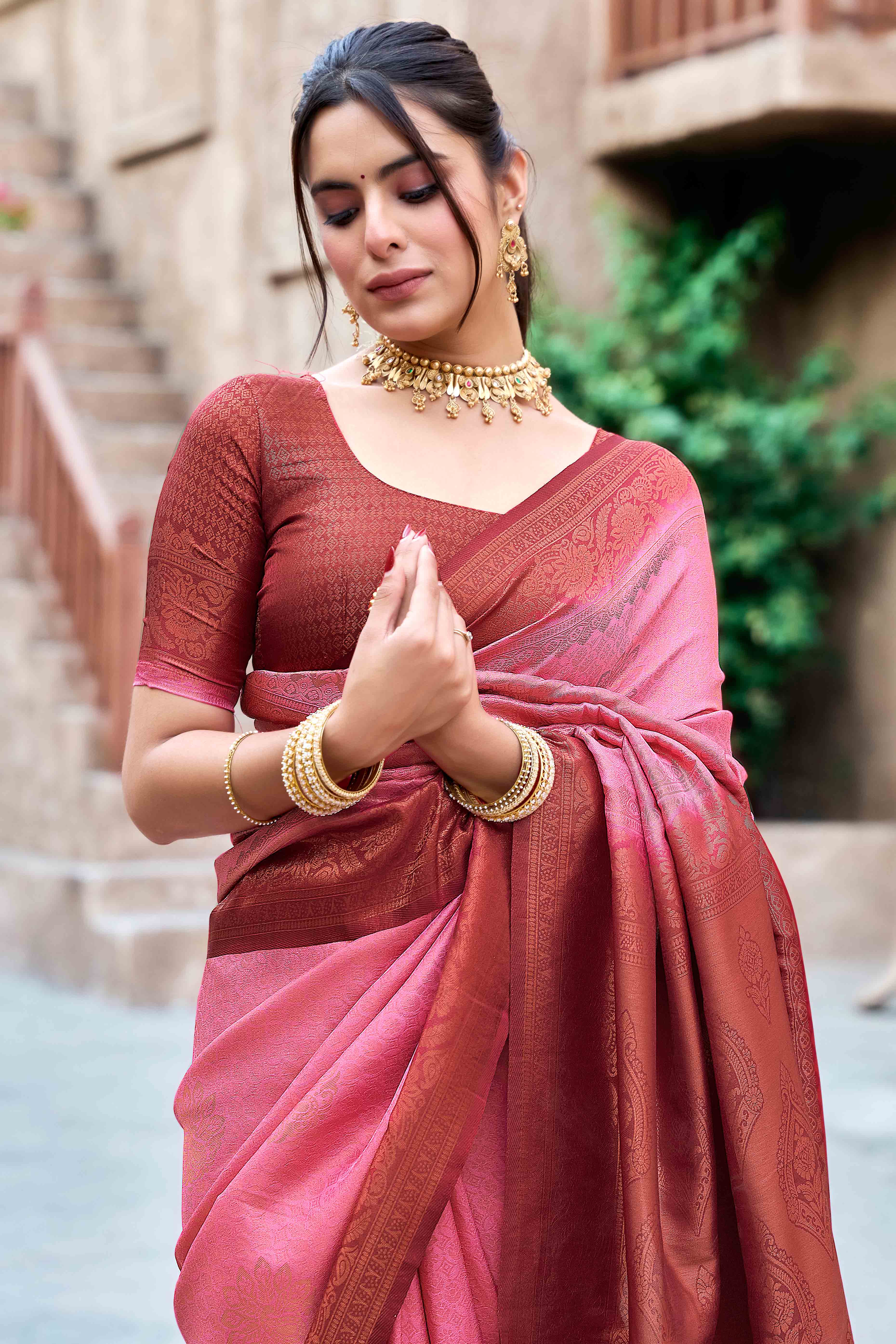 Gajari Pink Banarasi Silk Saree Featuring Elegant Floral Woven & Delicate Tassel Edging