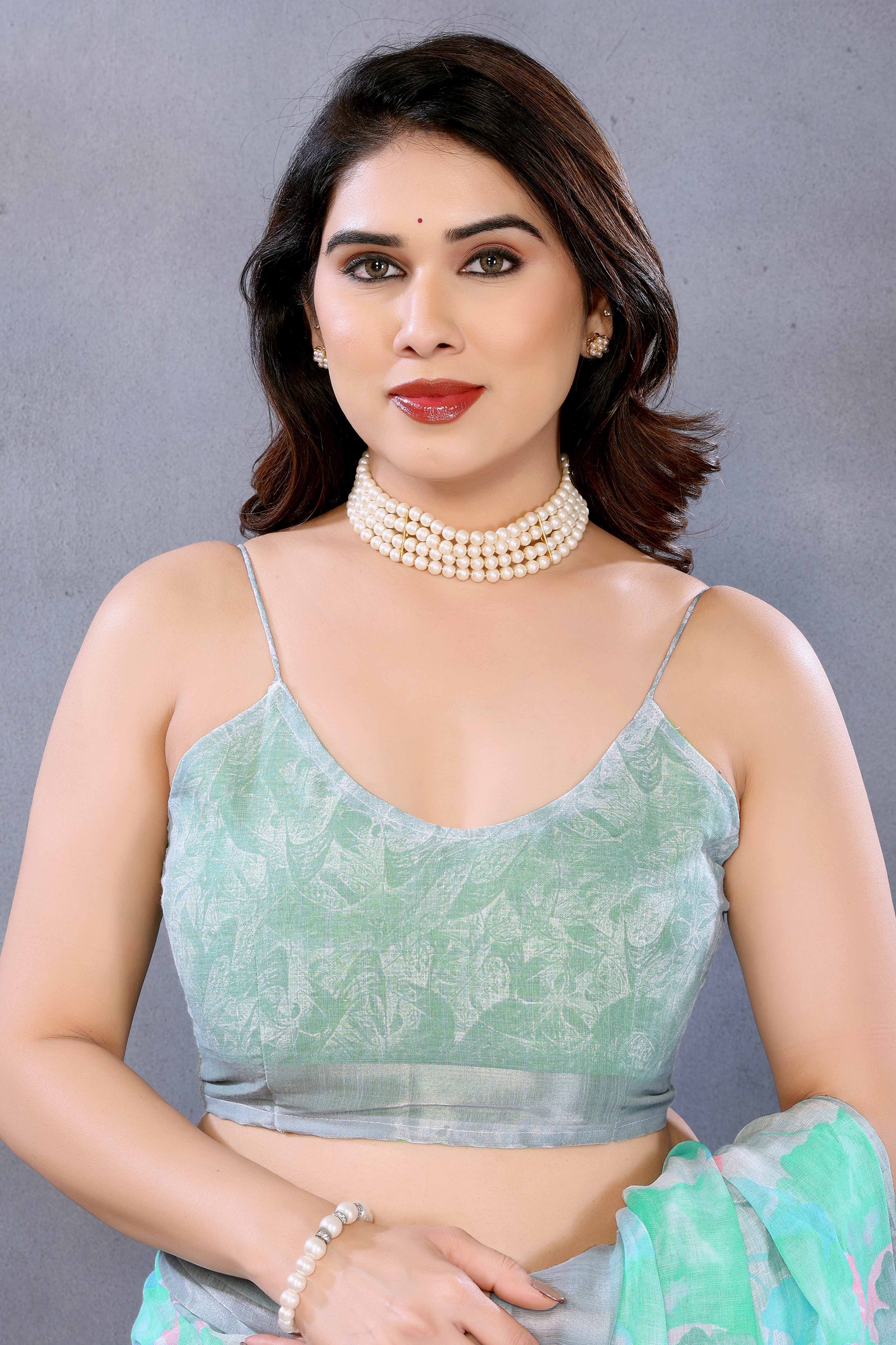 Turquoise Floral Printed Linen Saree Accented With A Classic Patta Border