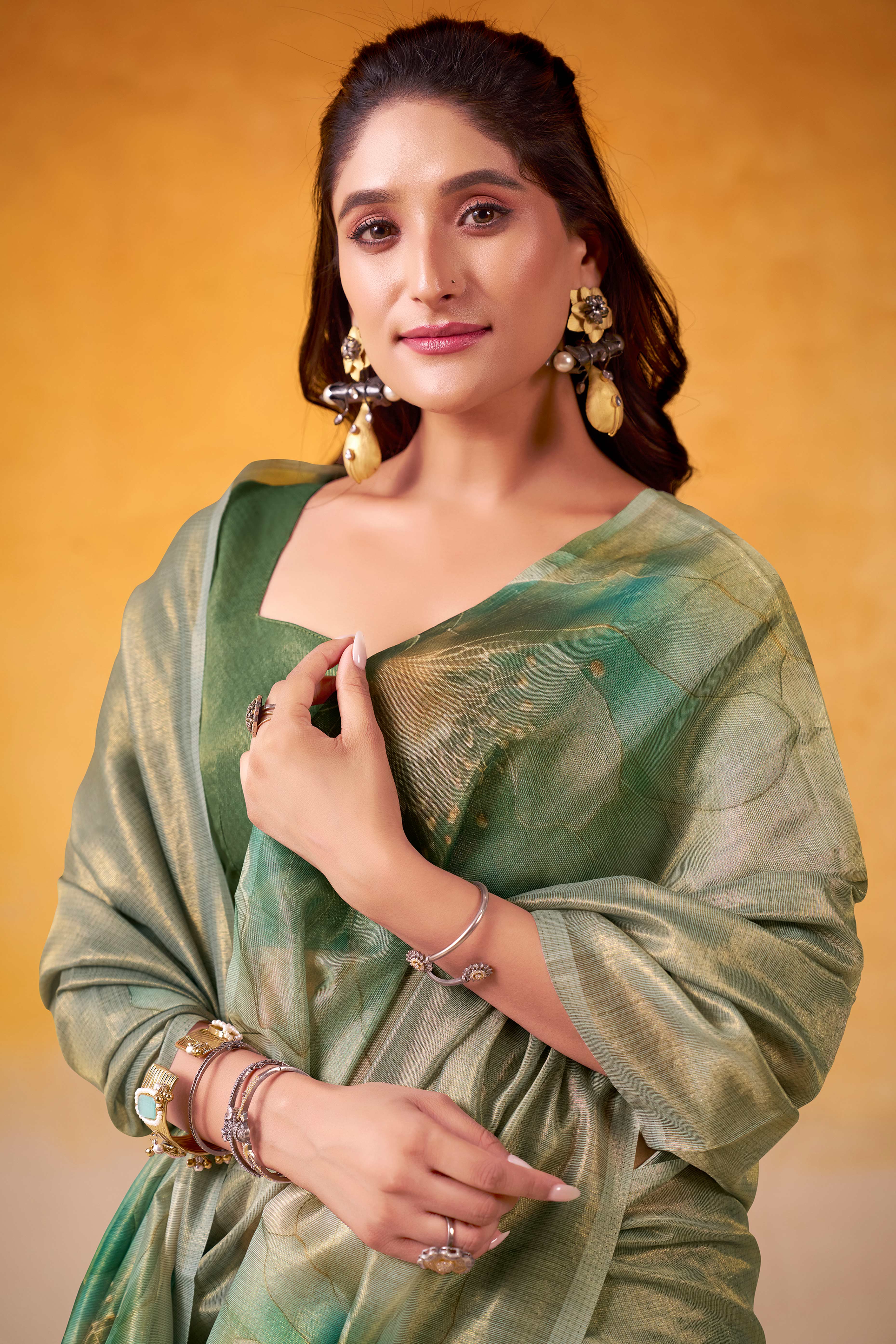 Sophisticated Dusty Green Floral Digital Print Tissue Saree Enhanced With Handmade Tassels