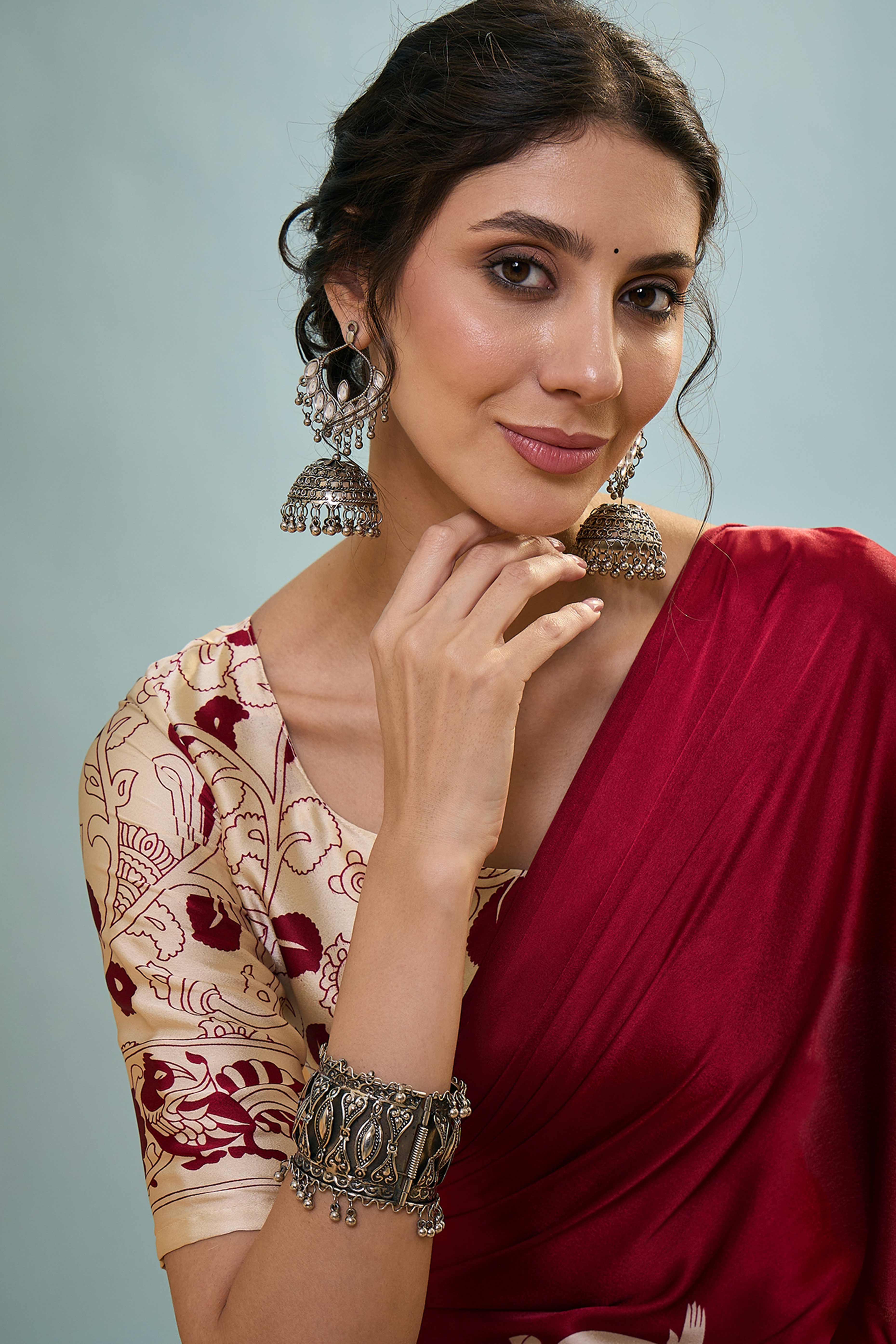 Red Kalamkari Style Modal Satin Saree Featuring Intricate Artistic Prints