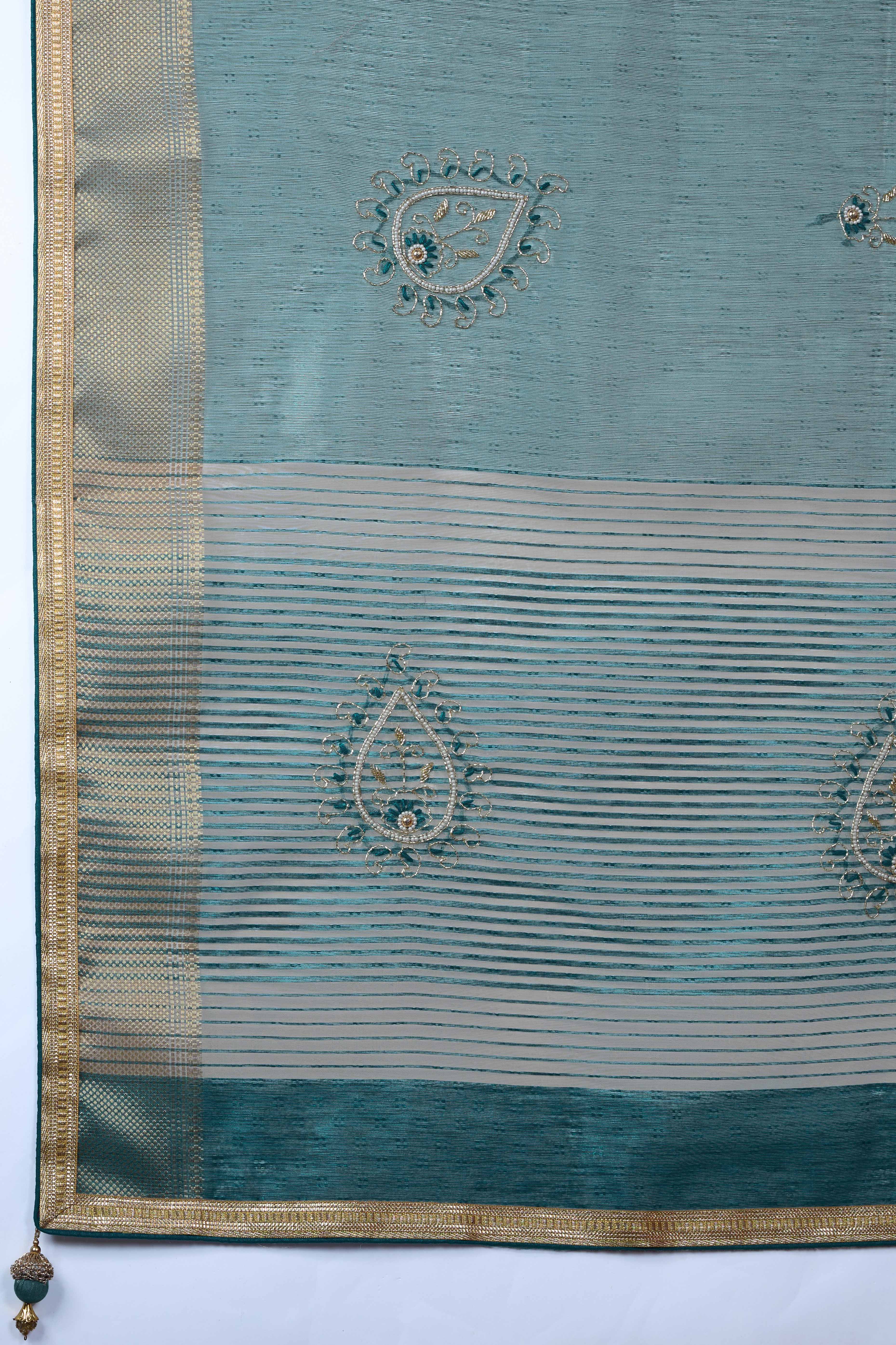 Teal Woven Linen Tissue Saree Featuring Beads Embellishment