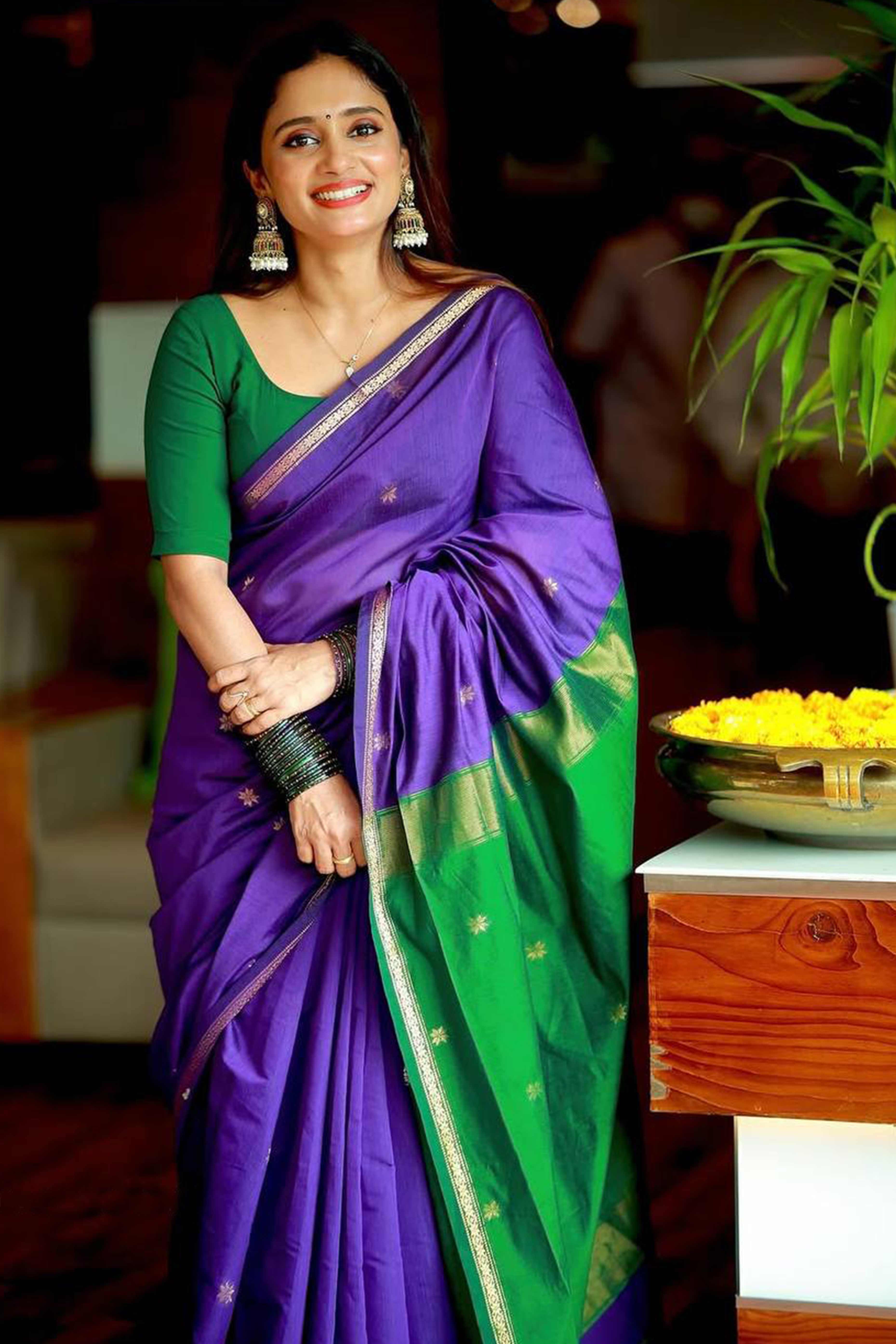 Purple Linen Cotton Saree Adorned with Intricate Zari Butti Weaving for a Refined Ethnic Appeal