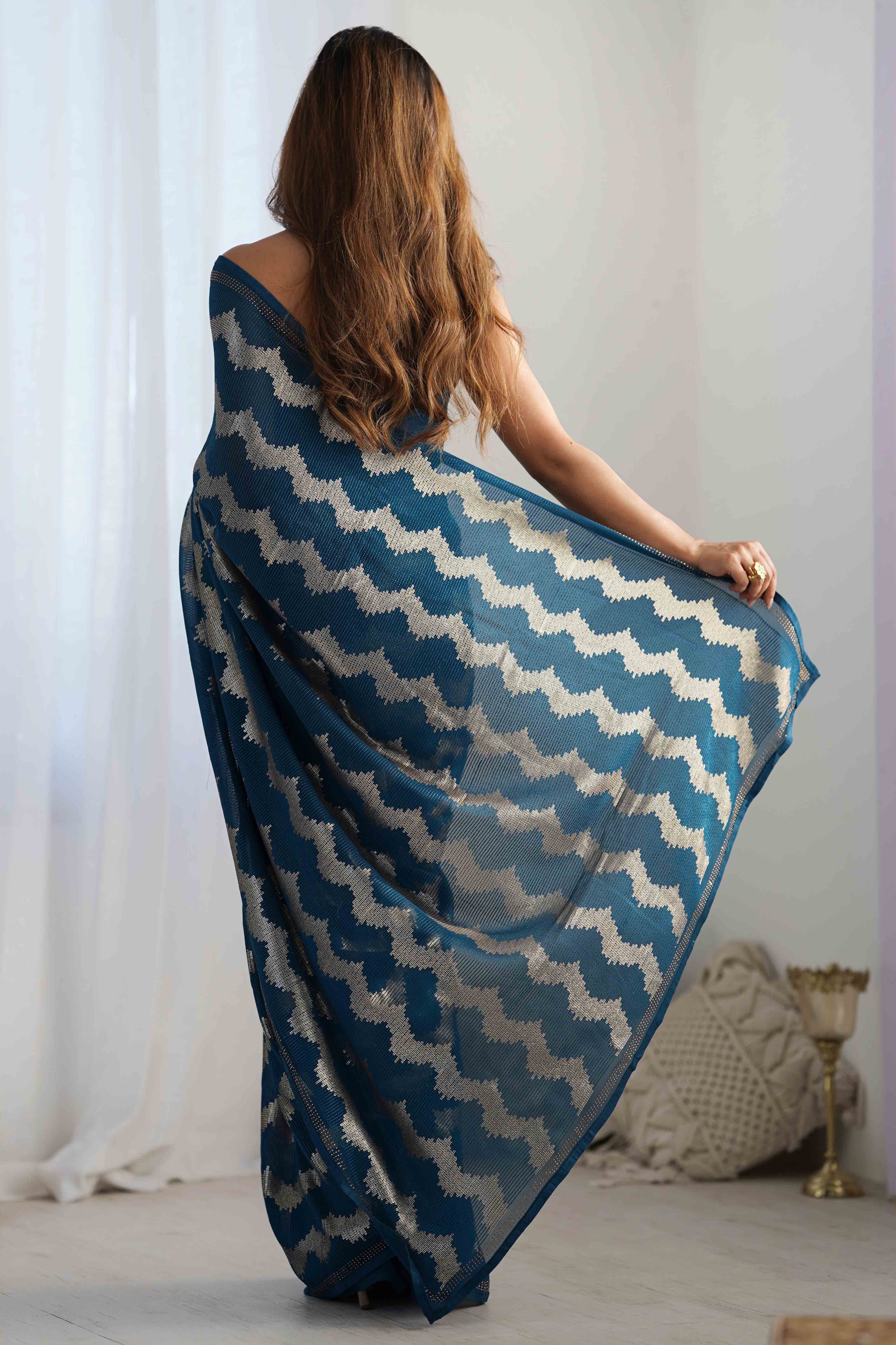 Teal Sequins Embroidered Georgette Saree