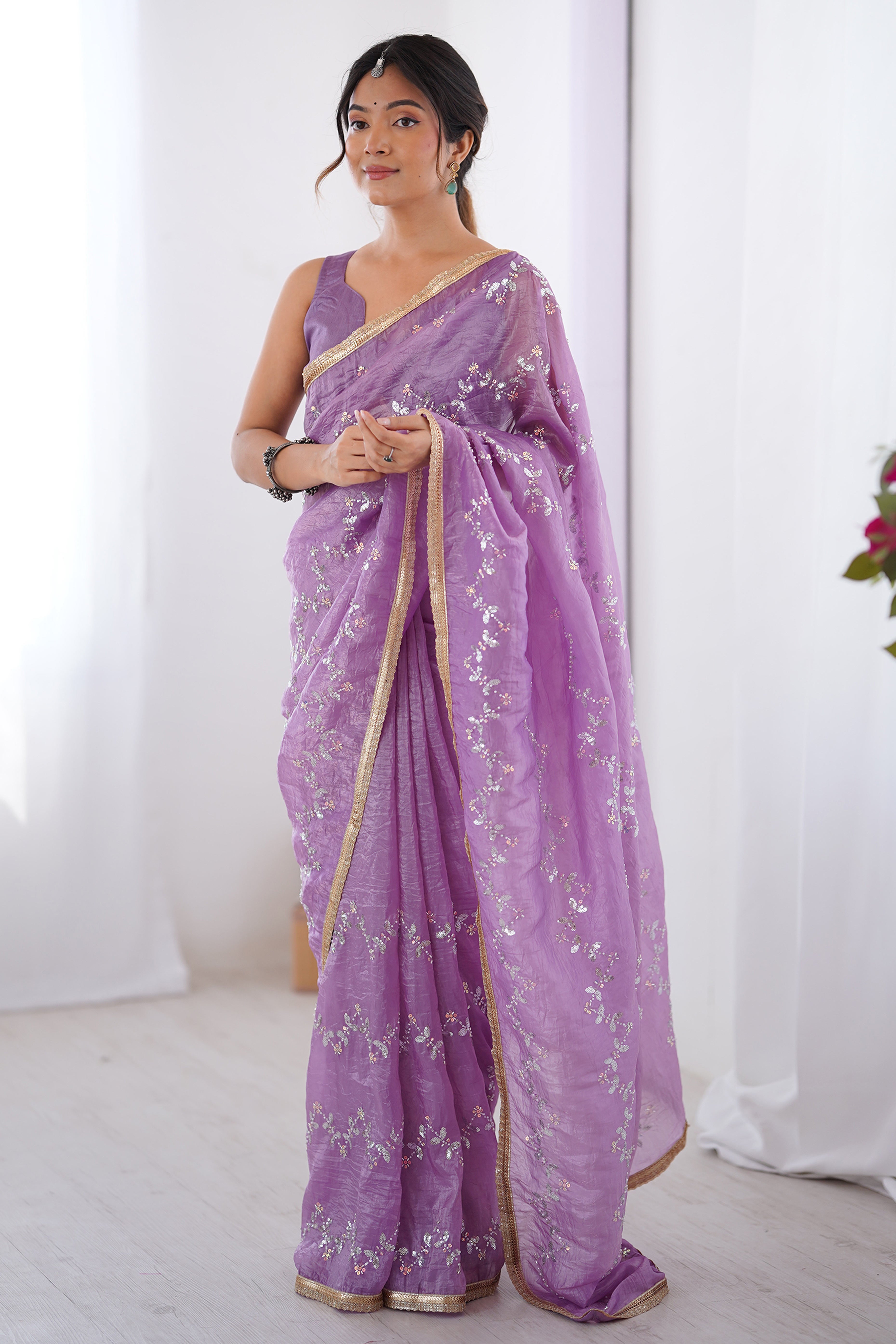 Dazzling Lavender Organza Saree Accented with Sequin, Bead & Stone Work and Delicate Lace Detailing