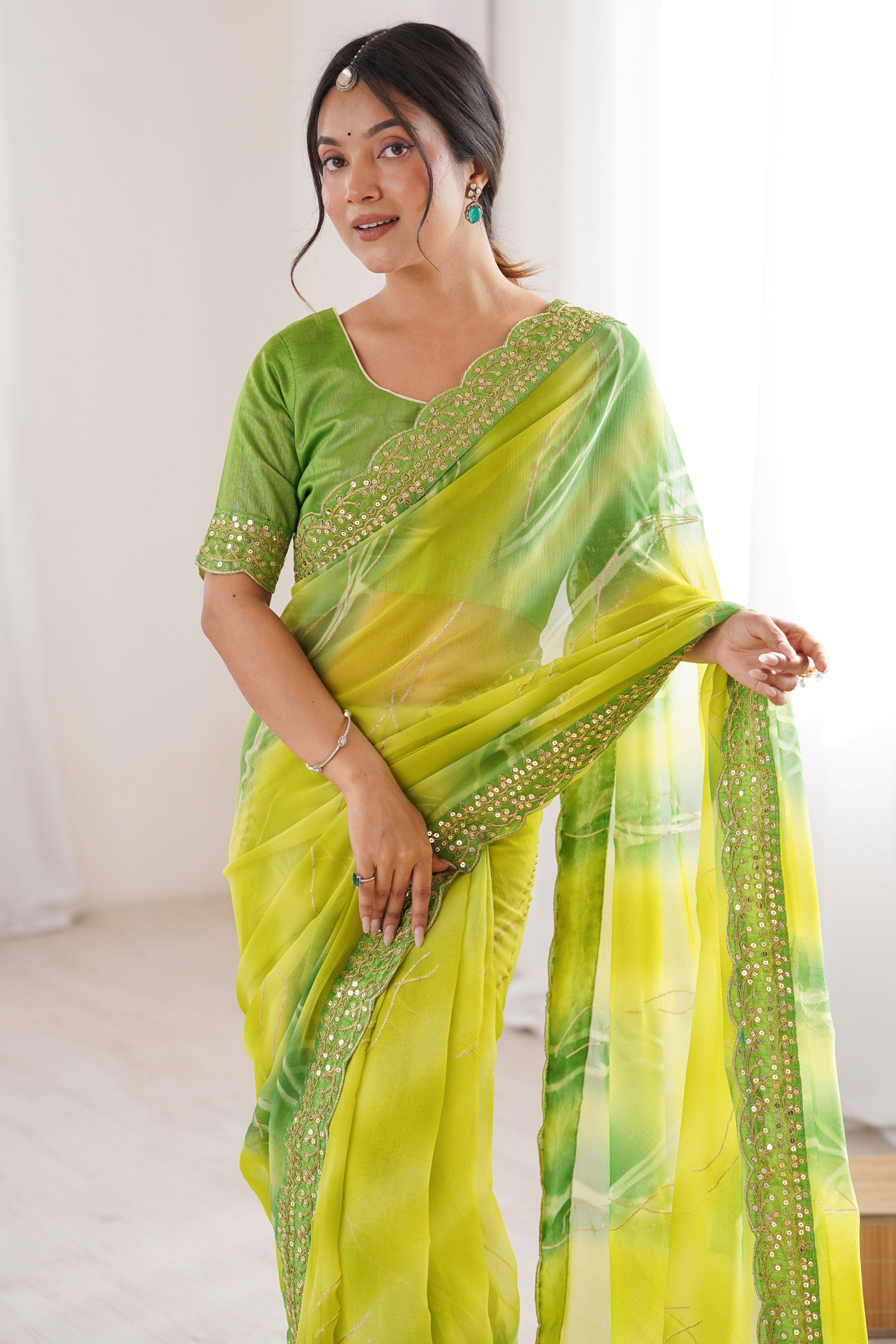 Graceful Green Foil Print Georgette Saree Featuring A Luxurious Cording Sequins Embroidered Border