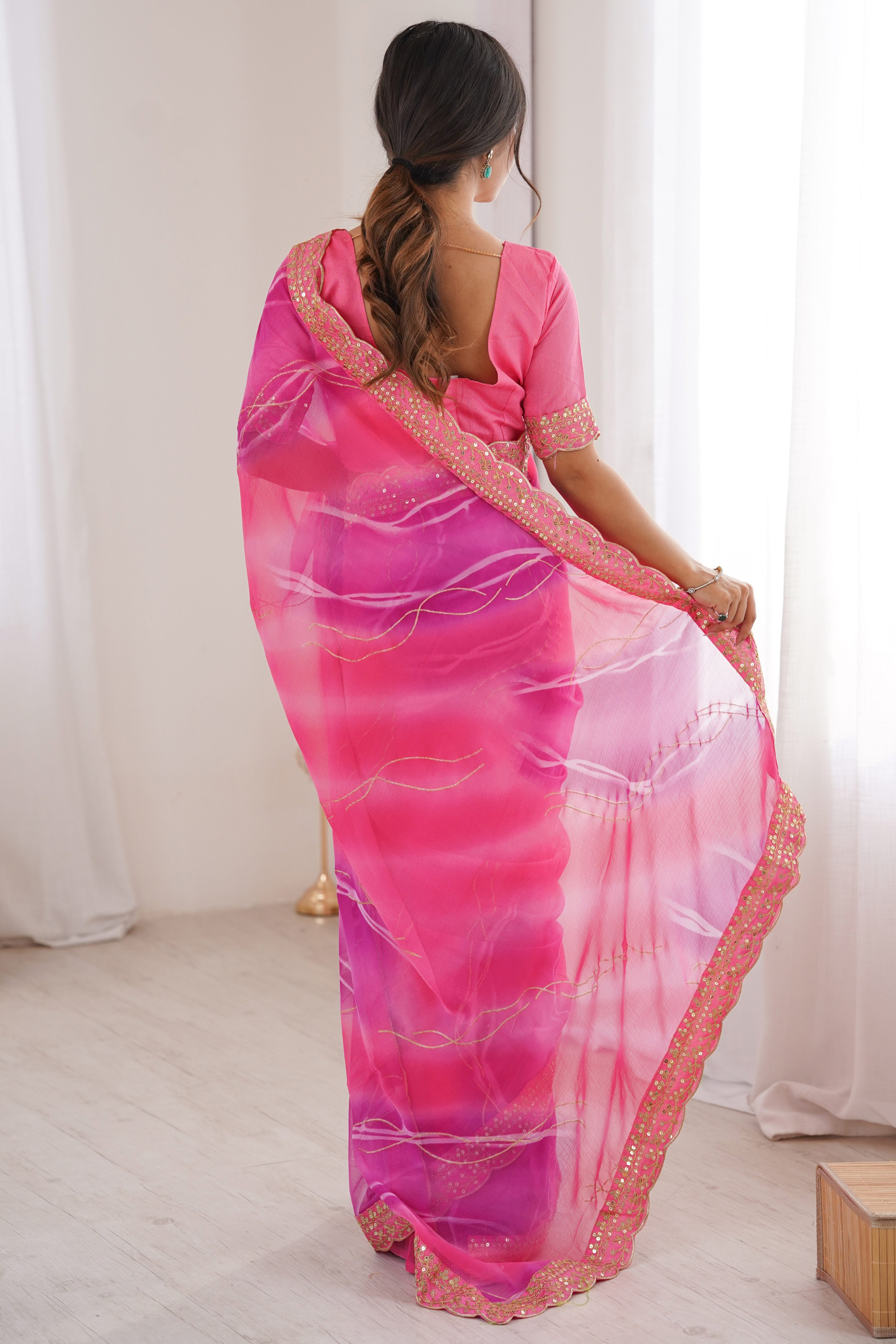 Graceful Pink Foil Print Georgette Saree Featuring A Luxurious Cording Sequins Embroidered Border