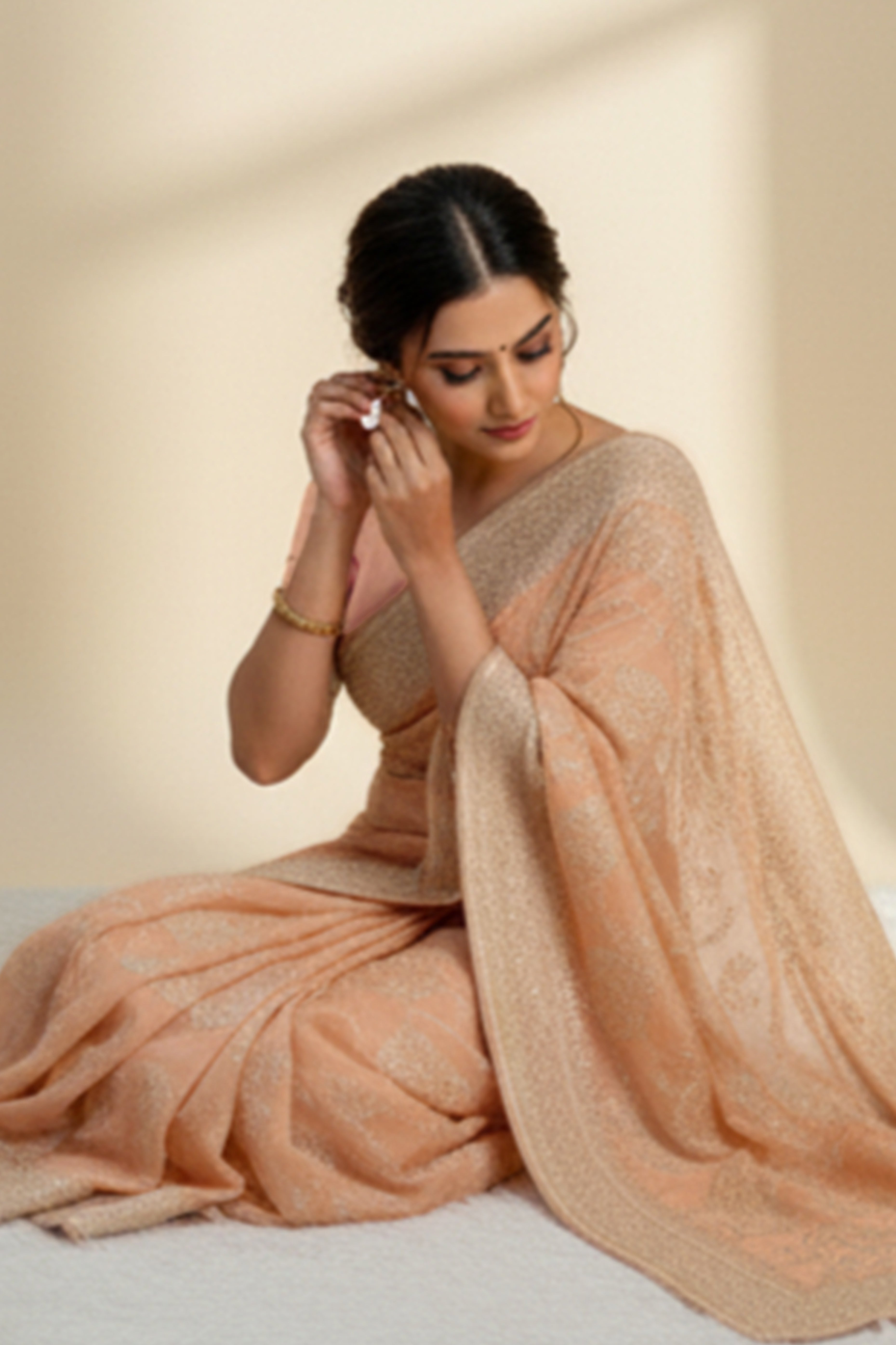 Lustrous Light Orange Organza Silk Saree Beautified With Paisley Embroidery & Glittering Sequins